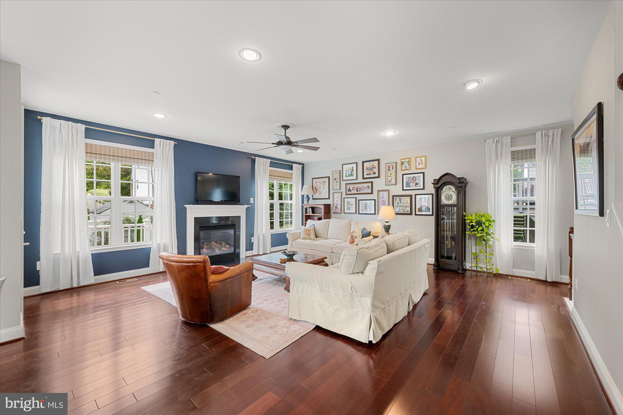 8808 Walnut Hill Road Chevy Chase, MD 20815 - Photo 13 of 60 a living room with fireplace furniture and a wooden floor