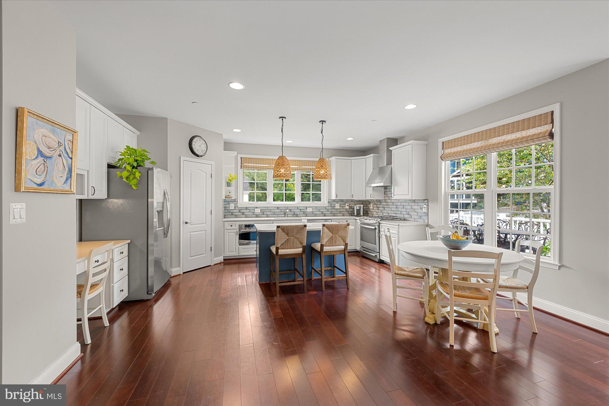 8808 Walnut Hill Road Chevy Chase, MD 20815 - Photo 16 of 60 a large kitchen with a table and chairs