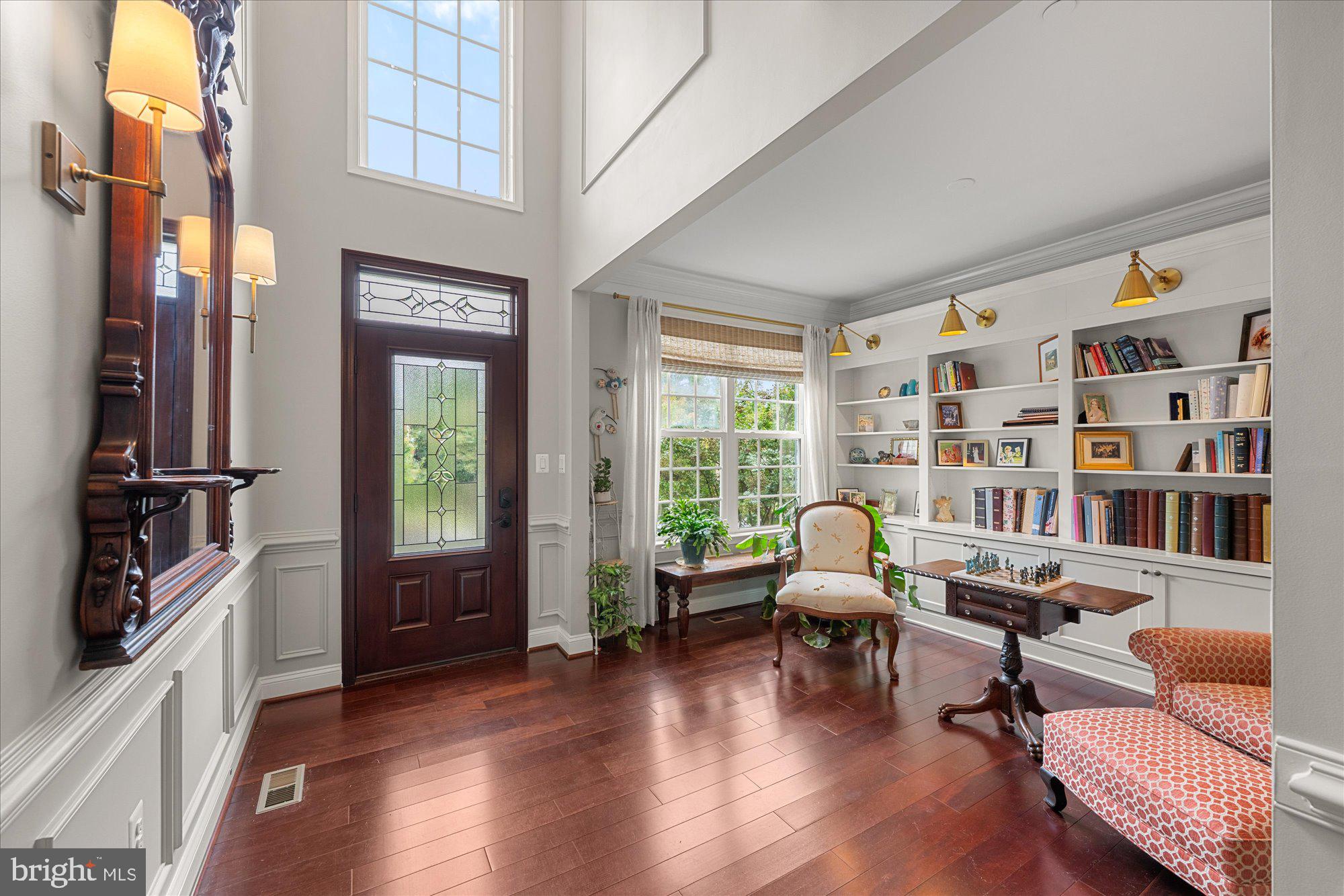 8808 Walnut Hill Road Chevy Chase, MD 20815 - Photo 2 of 60 a living room with furniture and a floor to ceiling window