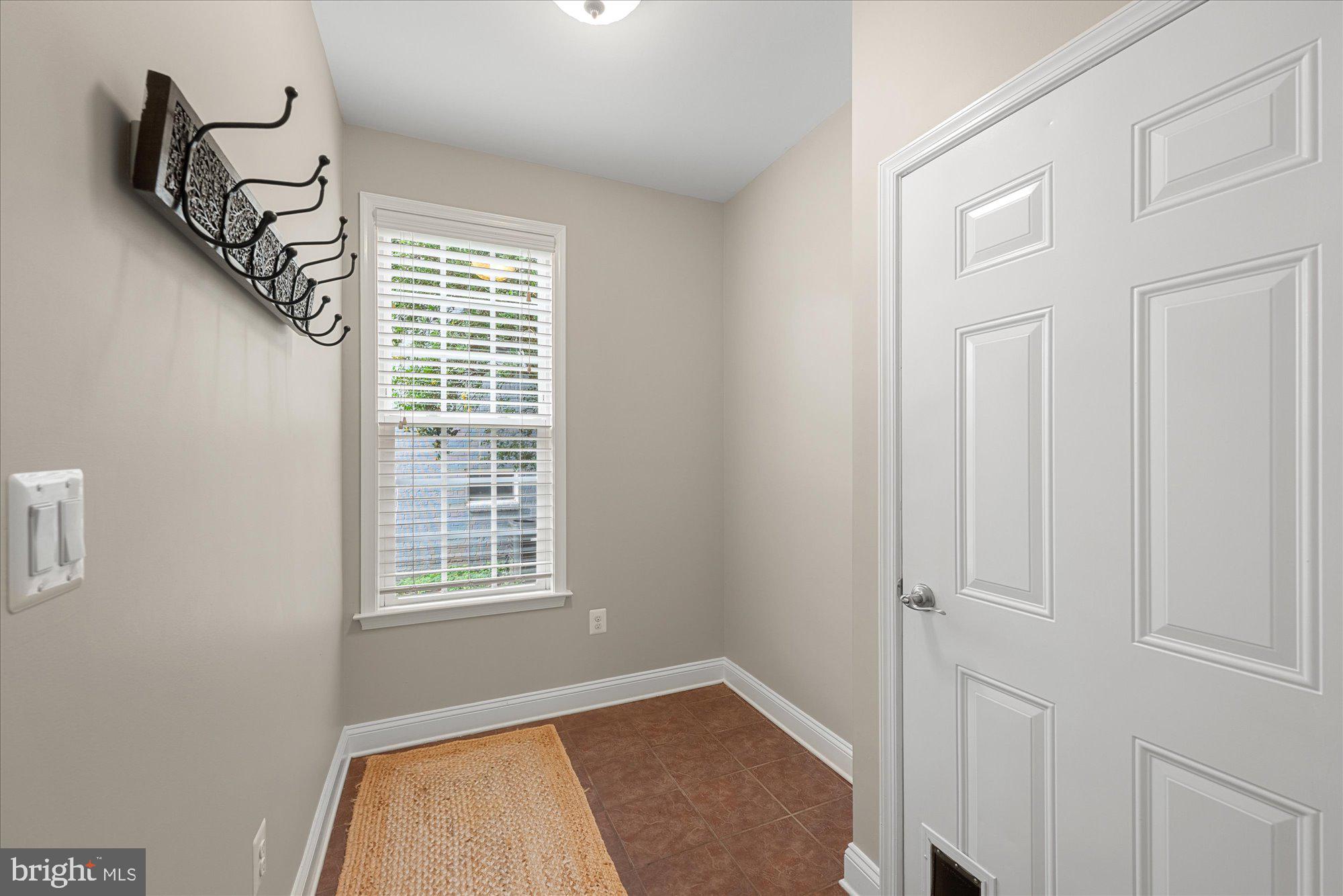 8808 Walnut Hill Road Chevy Chase, MD 20815 - Photo 25 of 60 a view of an empty room with a window