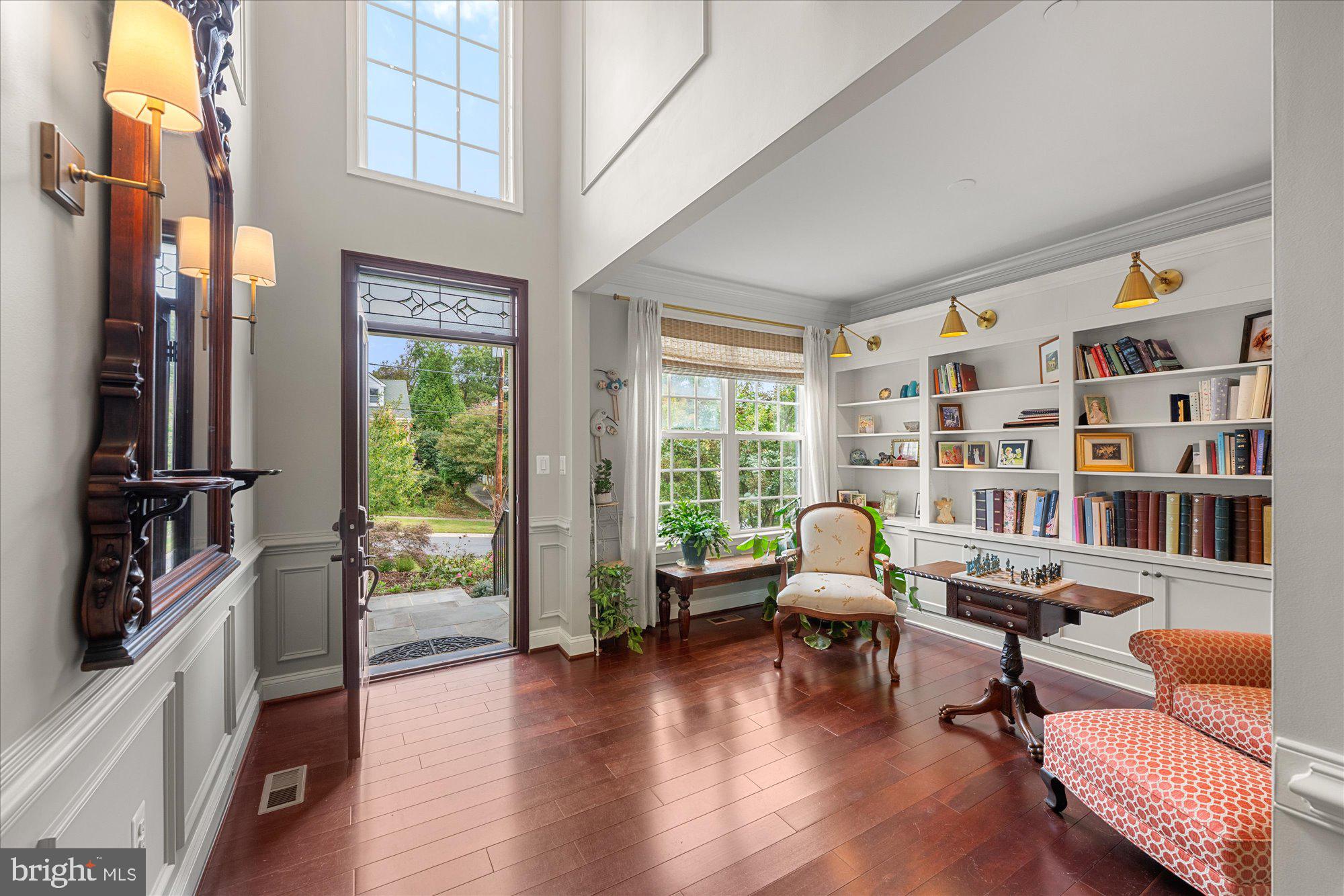 8808 Walnut Hill Road Chevy Chase, MD 20815 - Photo 3 of 60 a living room with furniture and a floor to ceiling window