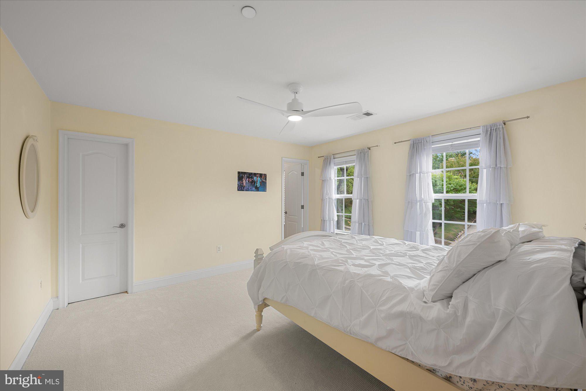 8808 Walnut Hill Road Chevy Chase, MD 20815 - Photo 34 of 60 a bedroom with a large bed and a window