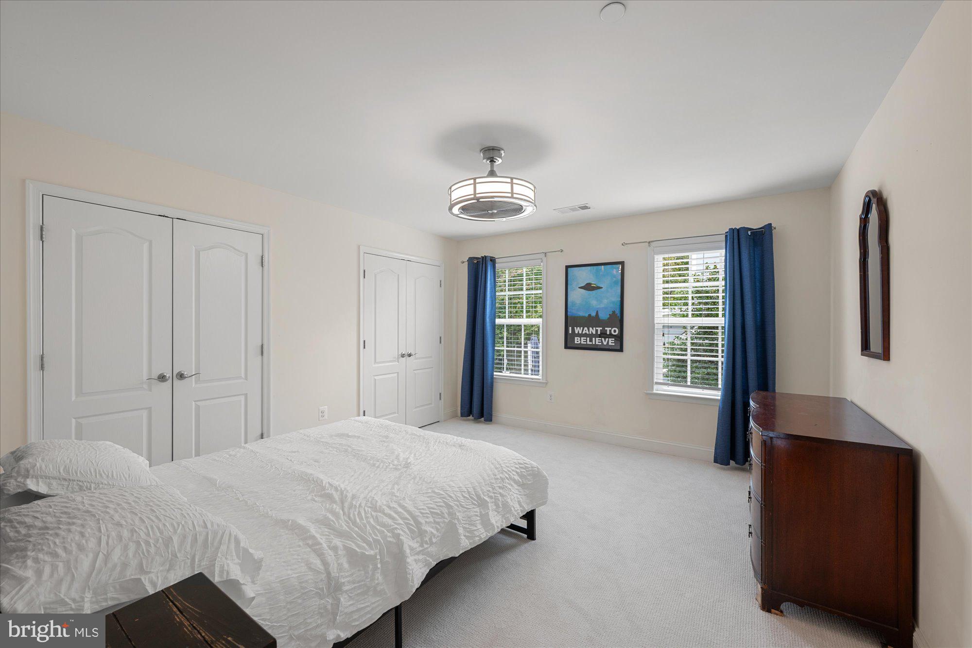 8808 Walnut Hill Road Chevy Chase, MD 20815 - Photo 36 of 60 a spacious bedroom with a bed and a dresser