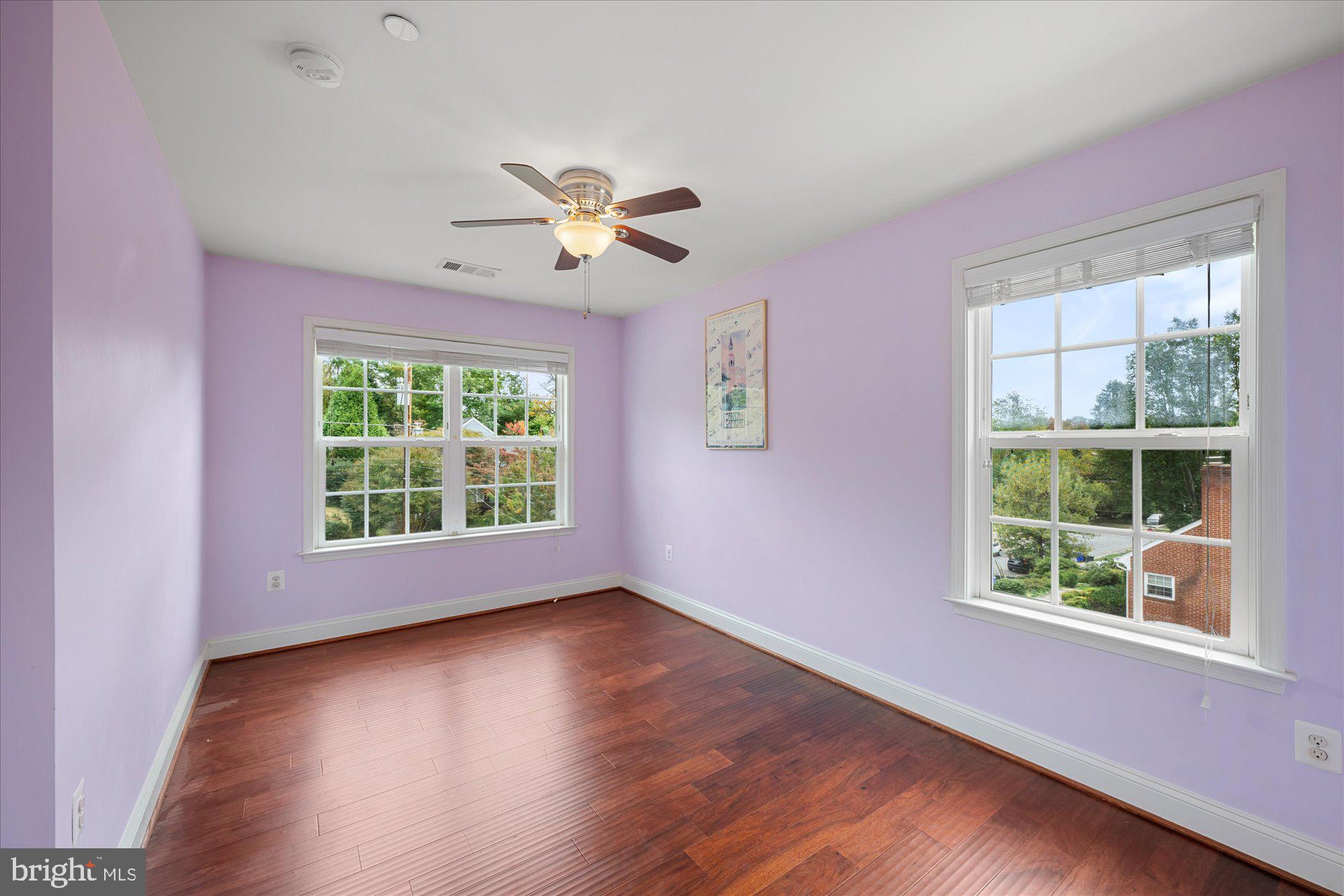 8808 Walnut Hill Road Chevy Chase, MD 20815 - Photo 37 of 60 a view of an empty room with a window and wooden floor