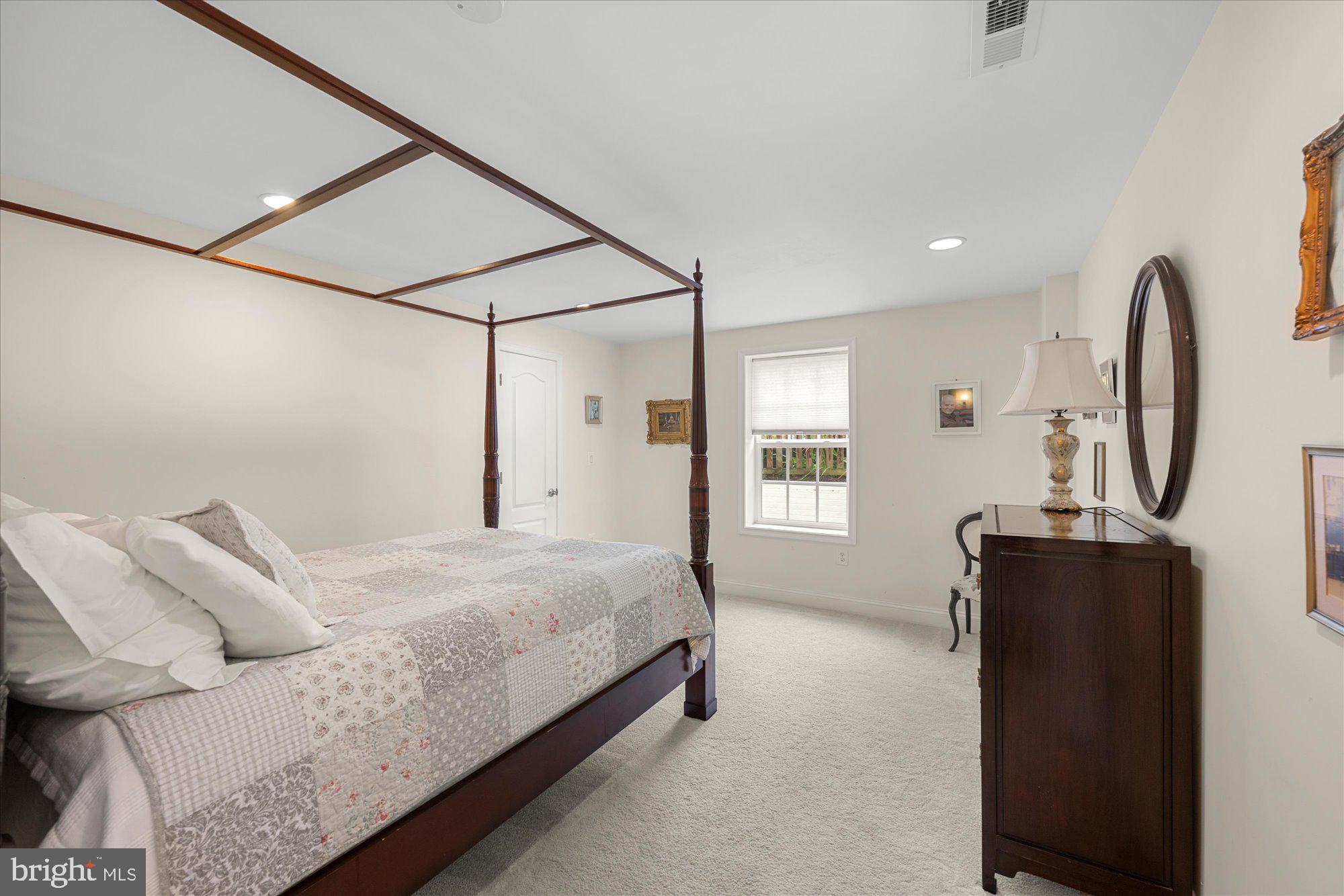 8808 Walnut Hill Road Chevy Chase, MD 20815 - Photo 44 of 60 a bedroom with a bed window and dresser