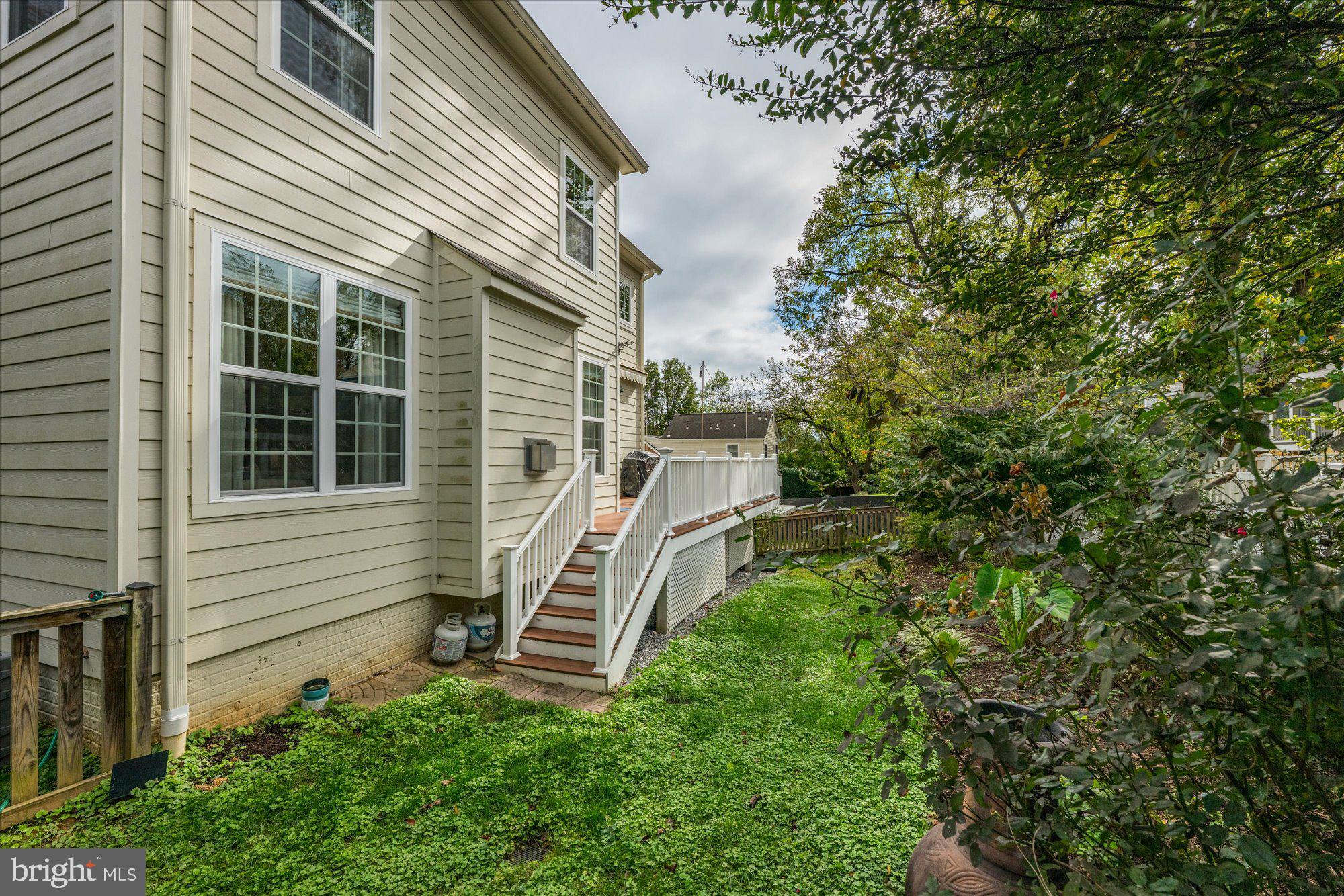 8808 Walnut Hill Road Chevy Chase, MD 20815 - Photo 51 of 60 a view of a house with a yard