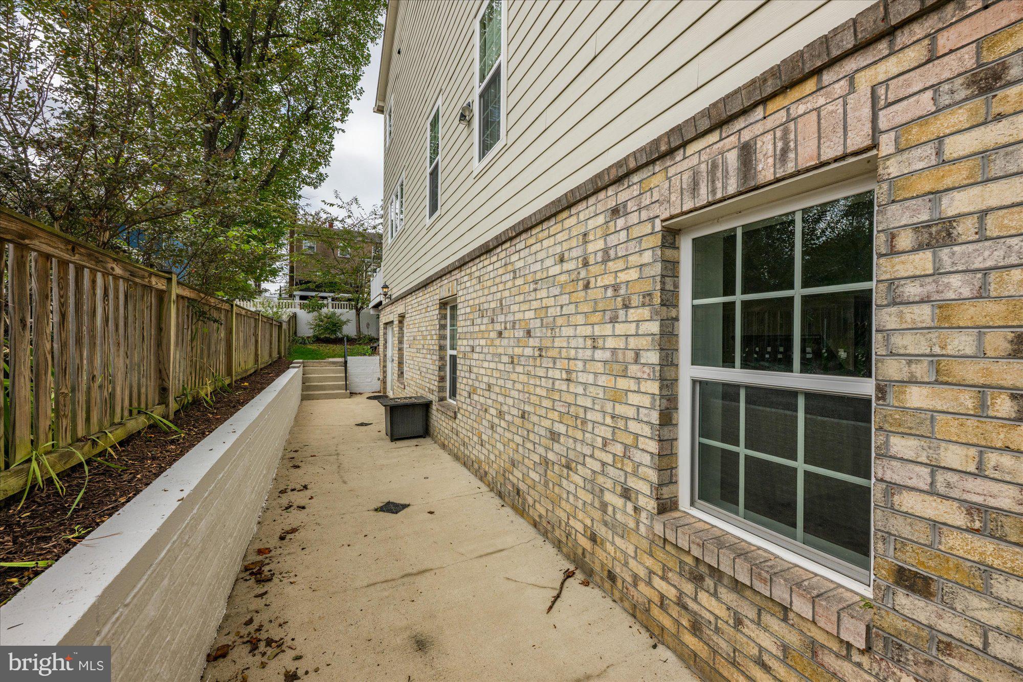 8808 Walnut Hill Road Chevy Chase, MD 20815 - Photo 55 of 60 a view of a pathway with a house