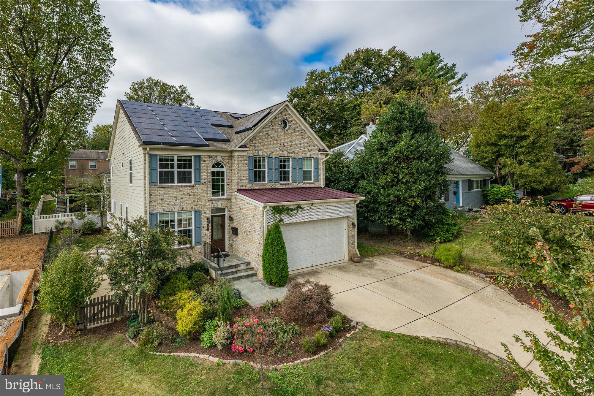 8808 Walnut Hill Road Chevy Chase, MD 20815 - Photo 56 of 60 front view of a house with a yard