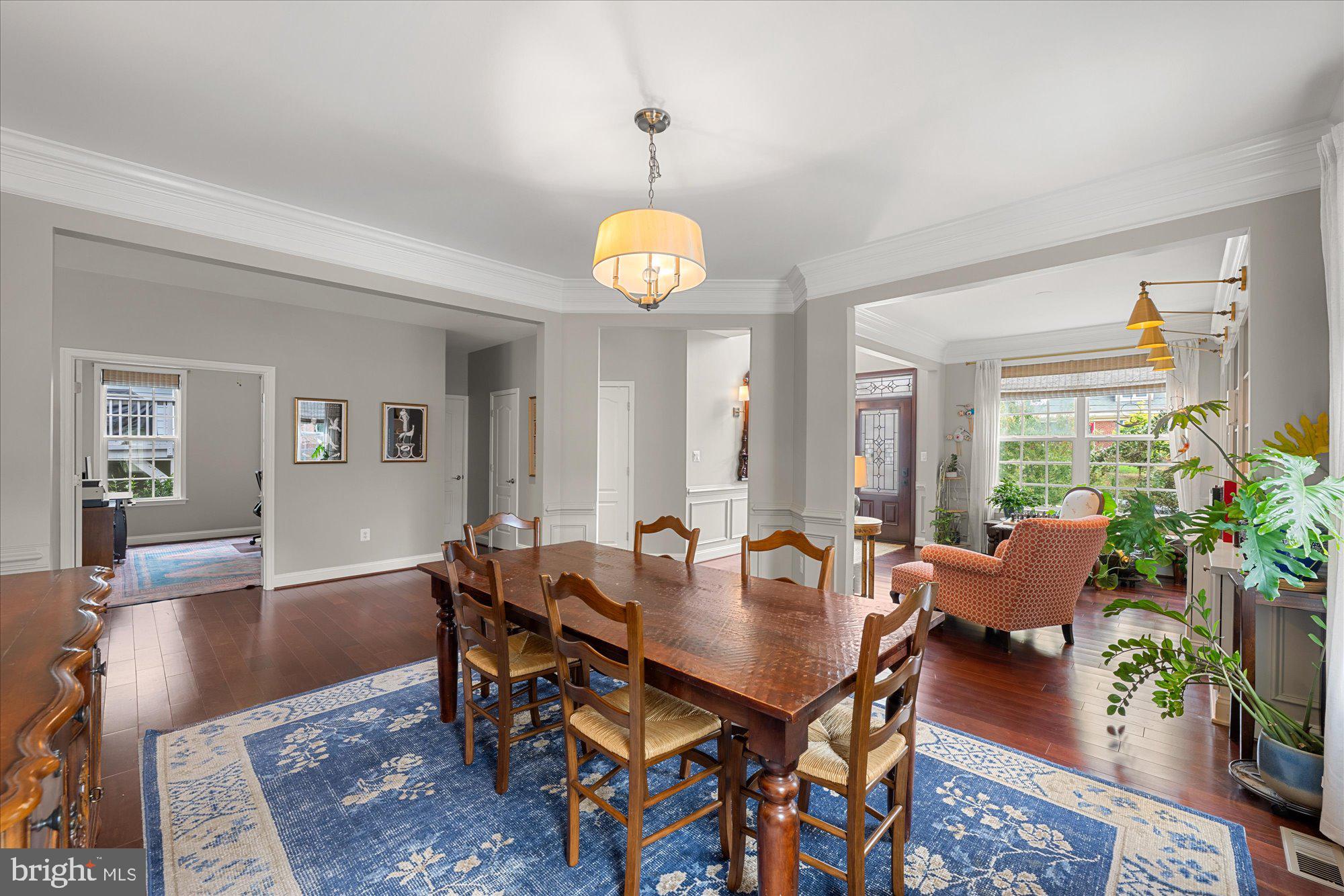8808 Walnut Hill Road Chevy Chase, MD 20815 - Photo 9 of 60 a view of a dining room with furniture and wooden floor