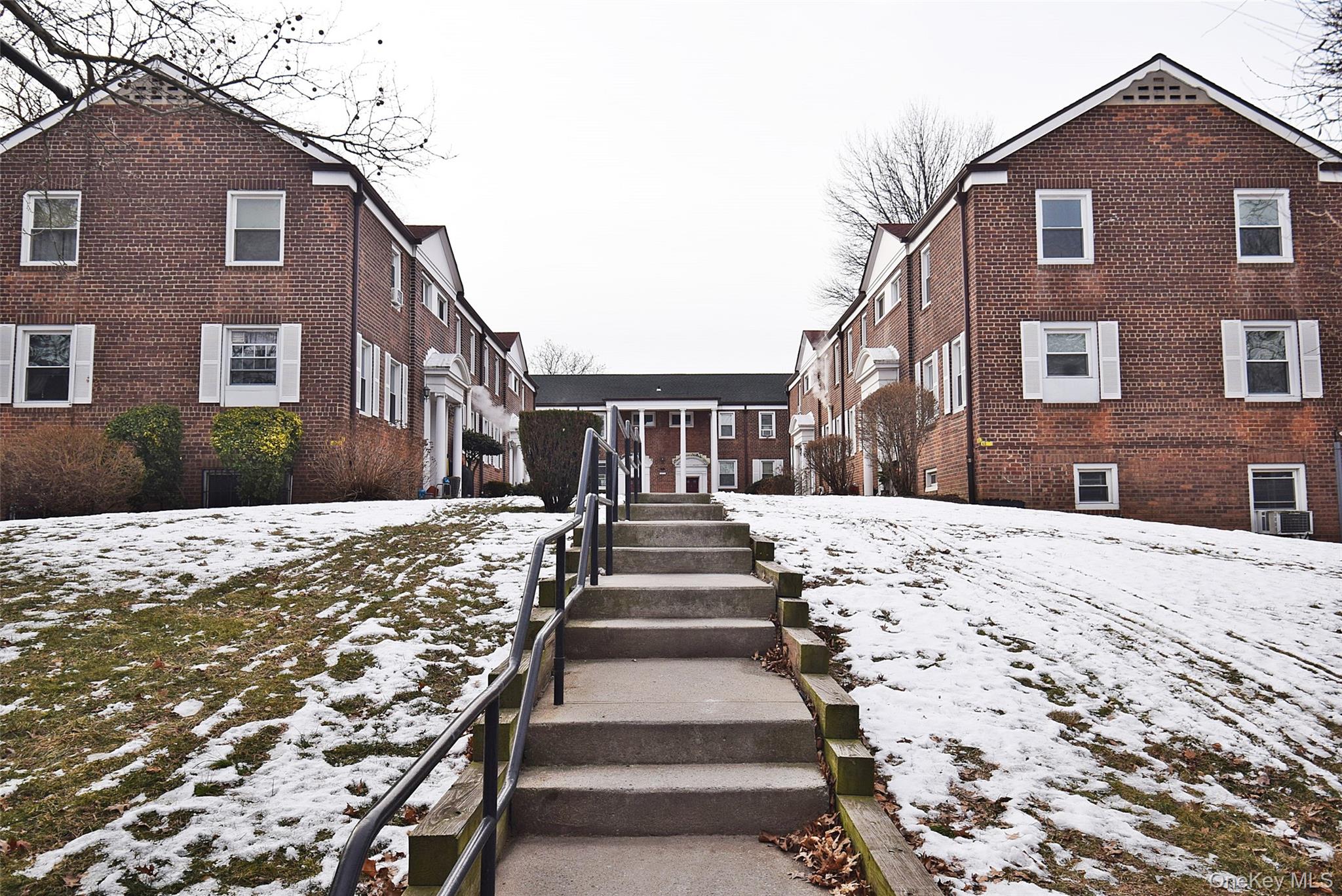 144-24 Village Road, Unit 67B Queens, NY 11435 - Photo 3 of 17 a front view of a house with a yard