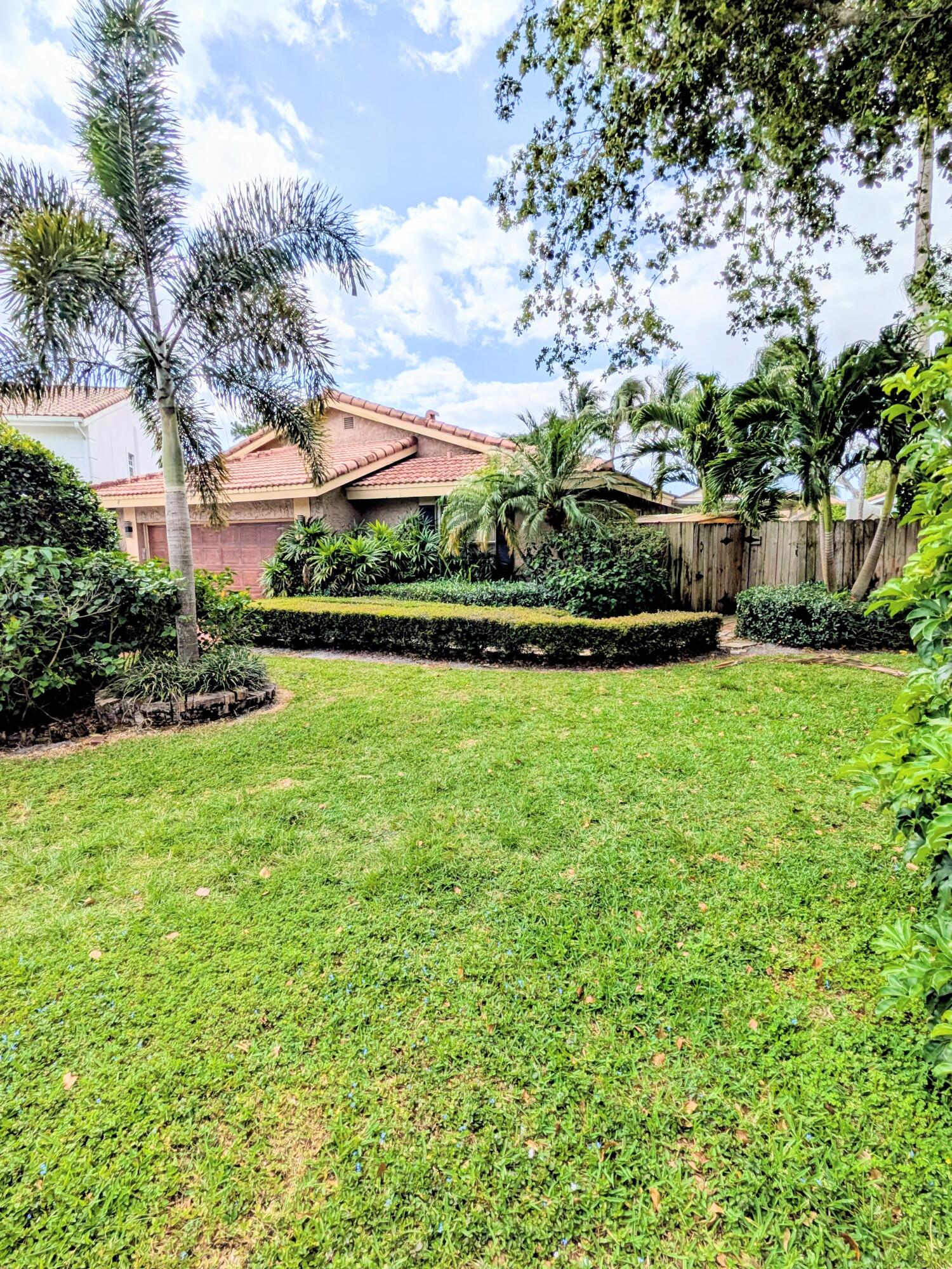 21089 Brookshire Terrace Boca Raton, FL 33433 - Photo 1 of 4 a view of a garden and basketball court