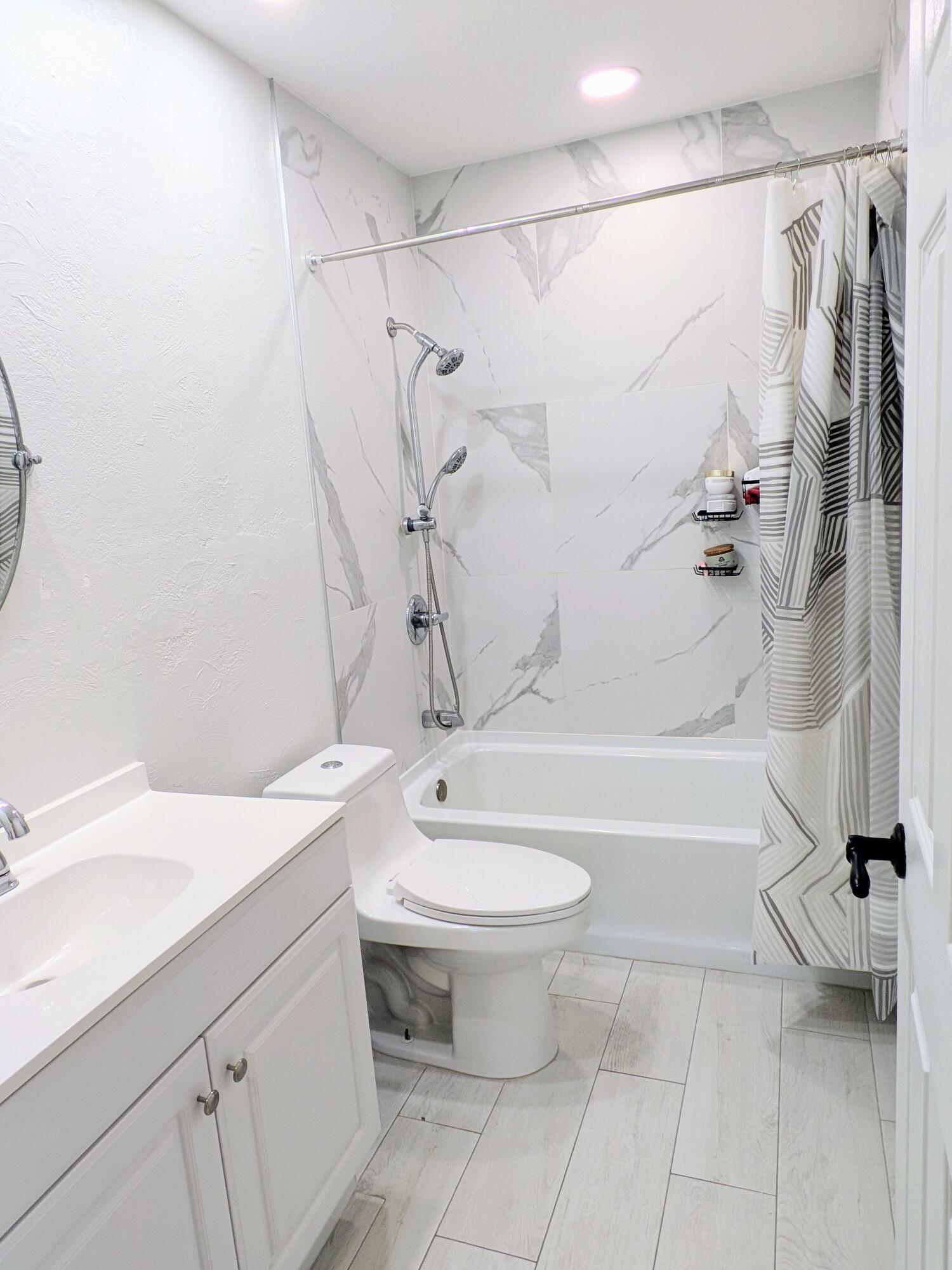 21089 Brookshire Terrace Boca Raton, FL 33433 - Photo 3 of 4 a bathroom with a sink toilet and shower