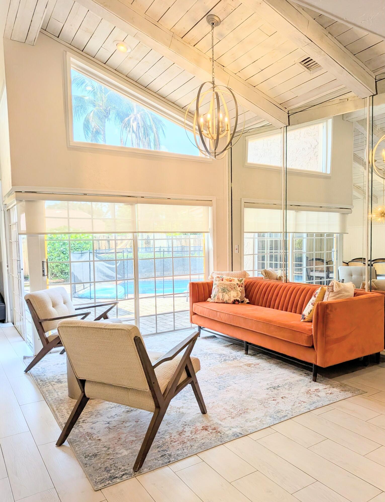 21089 Brookshire Terrace Boca Raton, FL 33433 - Photo 4 of 4 a living room with a large window and a table