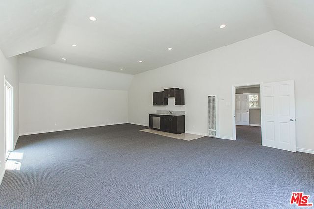 an empty room with a bathroom