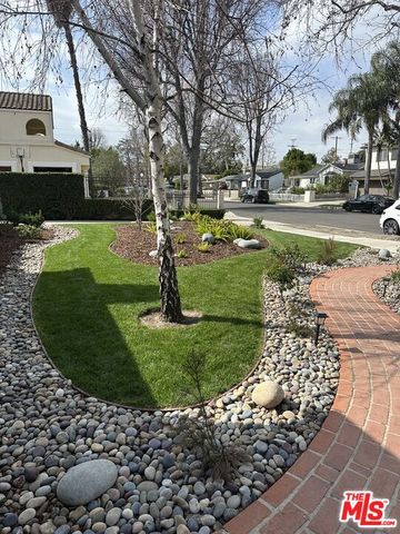 a view of a park with large trees