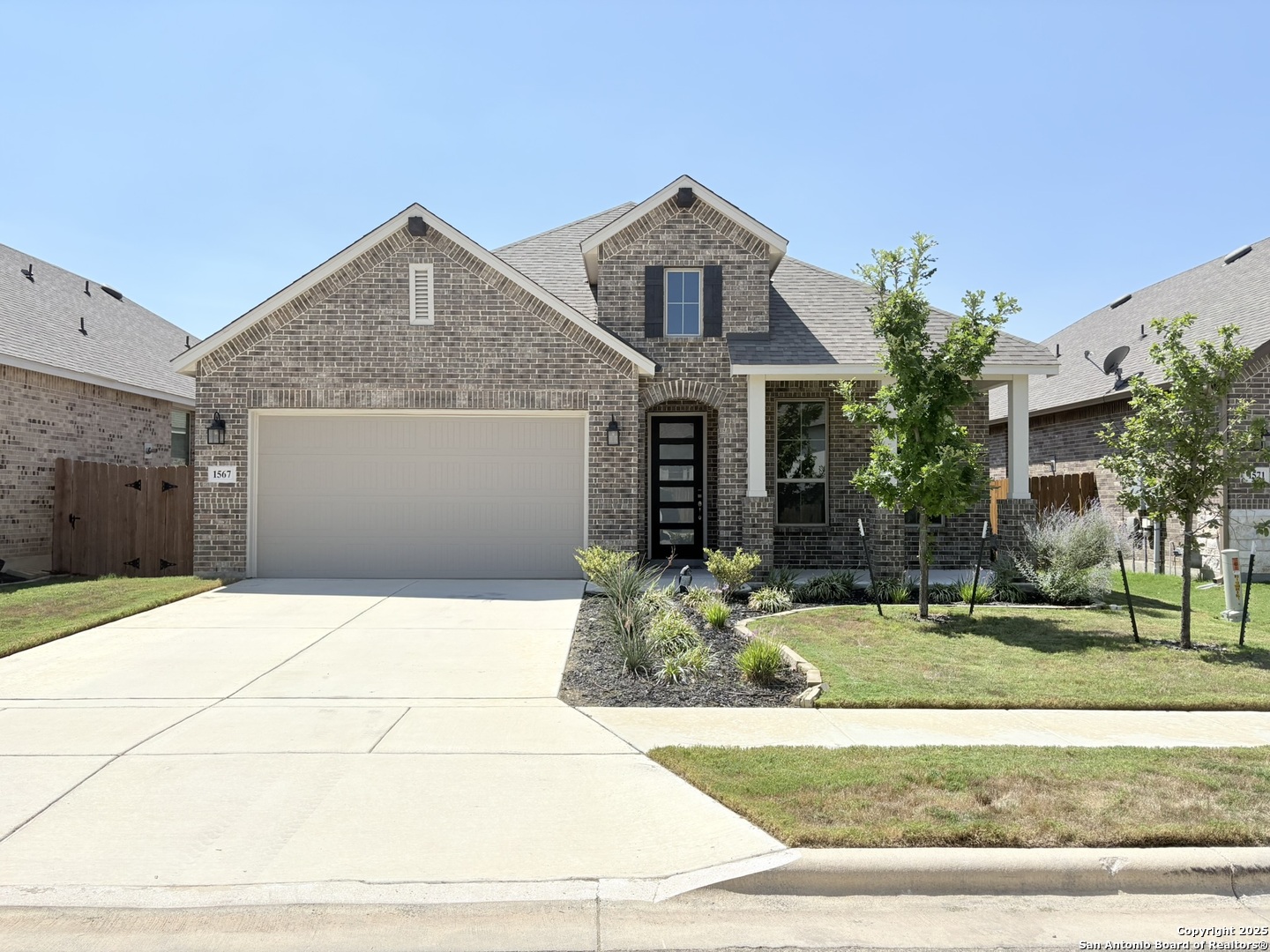1567 Terrys Gate Road New Braunfels, TX 78132 - Photo 1 of 30 a front view of a house with garden