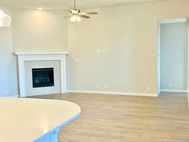 a view of an empty room with a fireplace