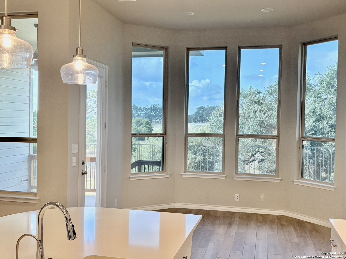 1567 Terrys Gate Road New Braunfels, TX 78132 - Photo 12 of 30 a view of a livingroom with a large window chandelier