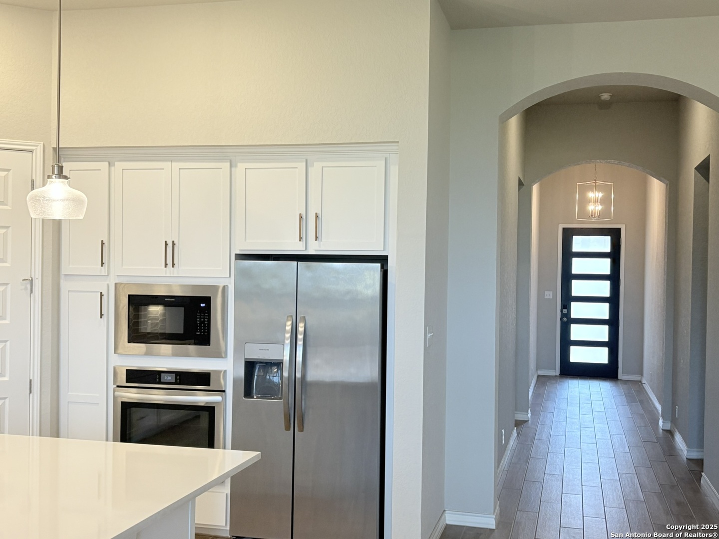 1567 Terrys Gate Road New Braunfels, TX 78132 - Photo 19 of 30 a kitchen with stainless steel appliances a refrigerator sink and cabinets