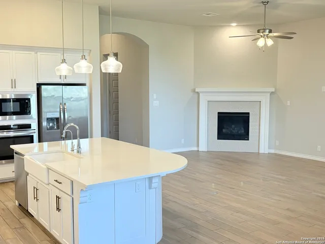 a kitchen with a table chairs and a stove