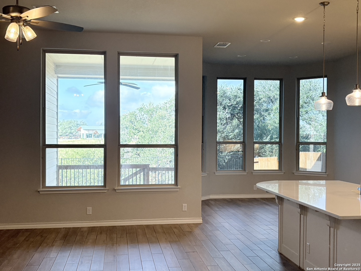 1567 Terrys Gate Road New Braunfels, TX 78132 - Photo 6 of 30 a view of an empty room with wooden floor and a window