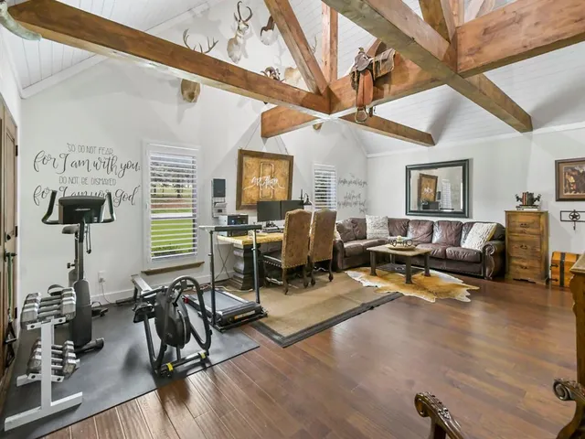a view of a livingroom with workspace and a couch