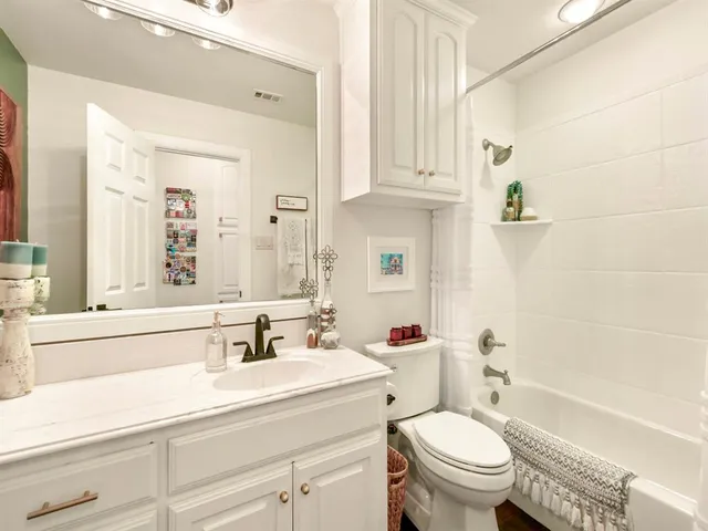 a bathroom with a sink a toilet and a bathtub