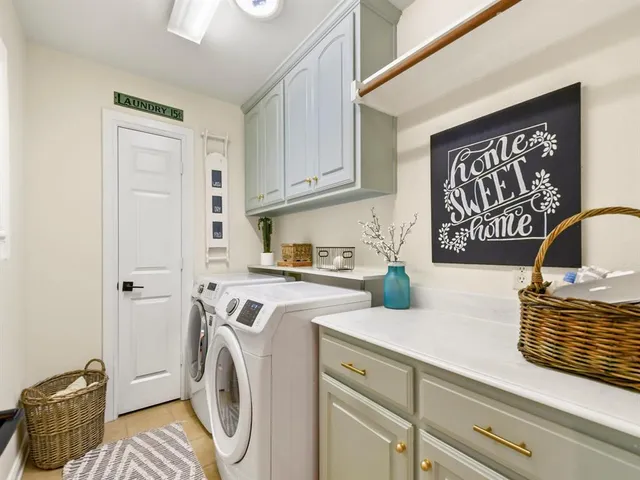 a kitchen with a refrigerator and a stove top oven