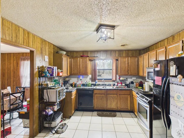 a kitchen with lots of appliances