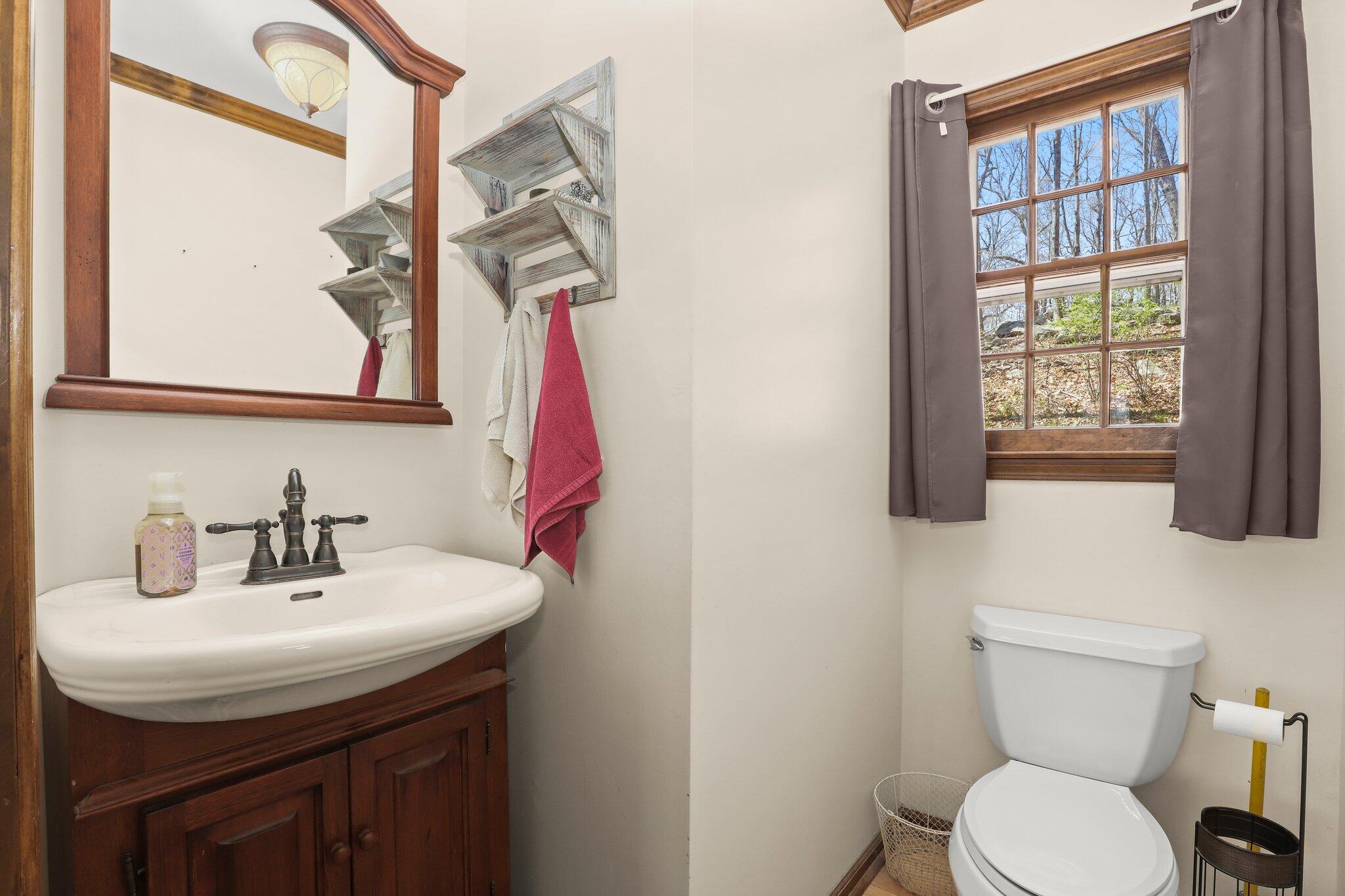 7 Allen Way Bethel, CT 06801 - Photo 14 of 31 a bathroom with a sink a toilet and a mirror