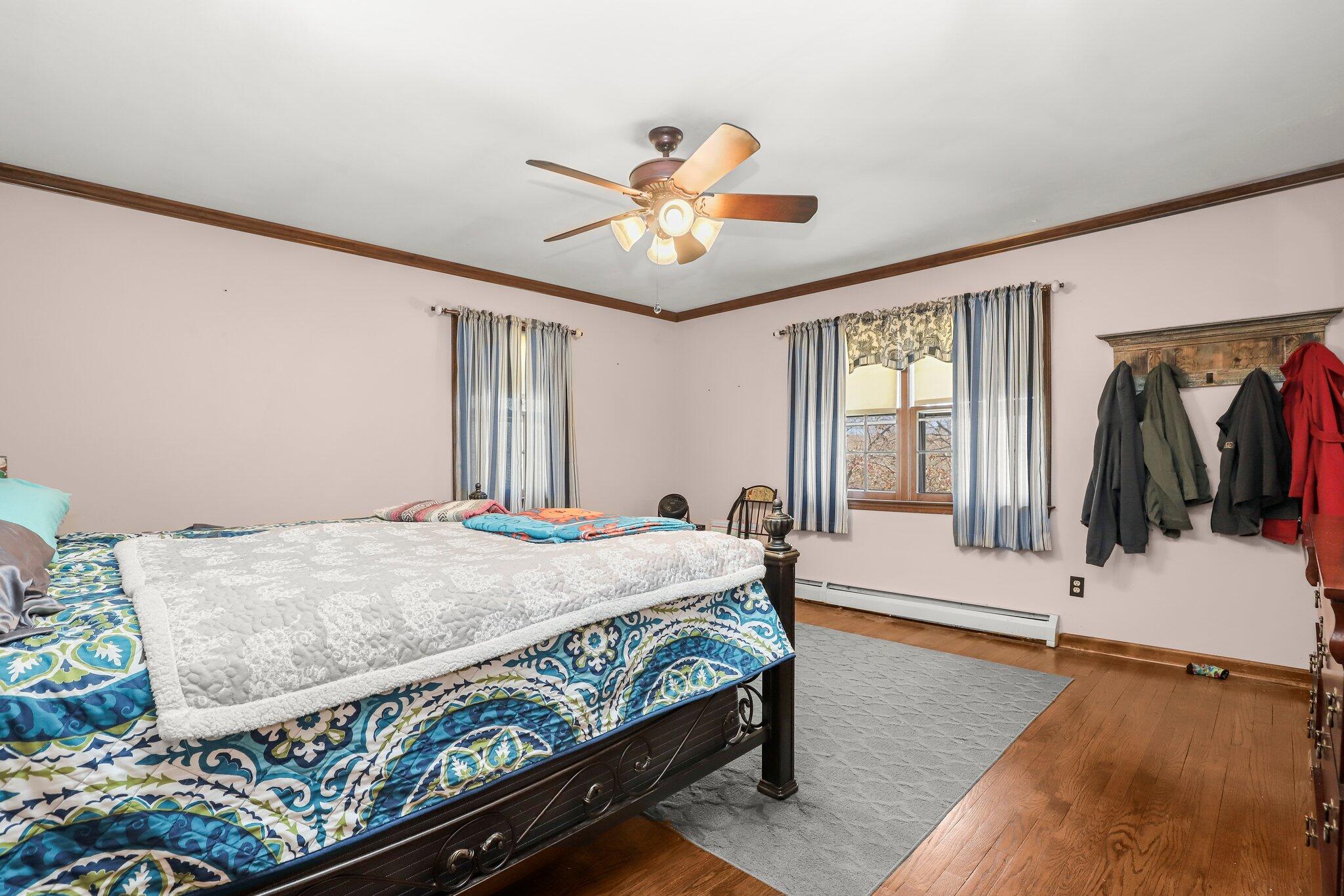 7 Allen Way Bethel, CT 06801 - Photo 18 of 31 a bedroom with a bed and a chandelier