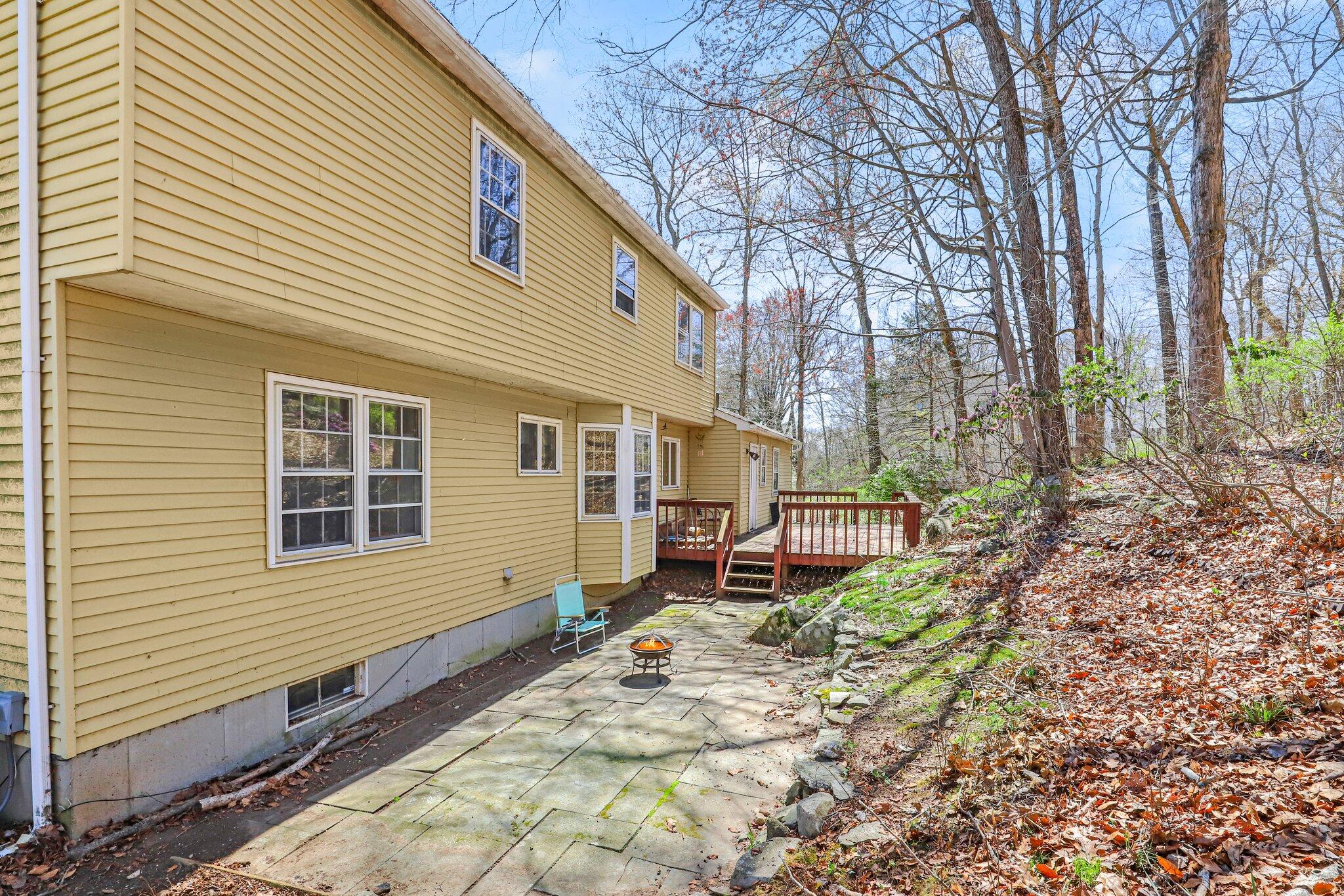 7 Allen Way Bethel, CT 06801 - Photo 28 of 31 a view of a house with a small yard and wooden fence