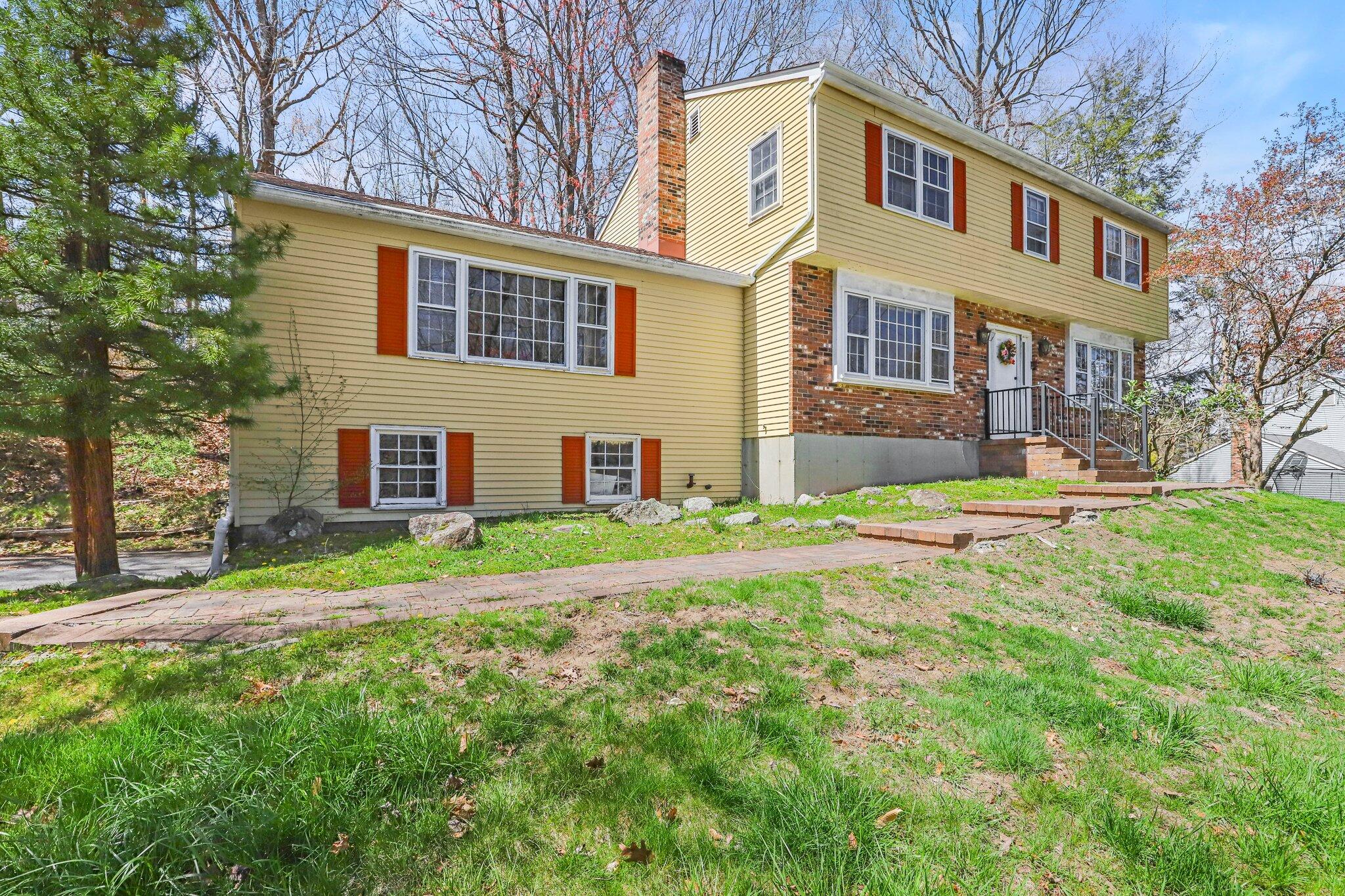 7 Allen Way Bethel, CT 06801 - Photo 30 of 31 a front view of a house with a yard and trees