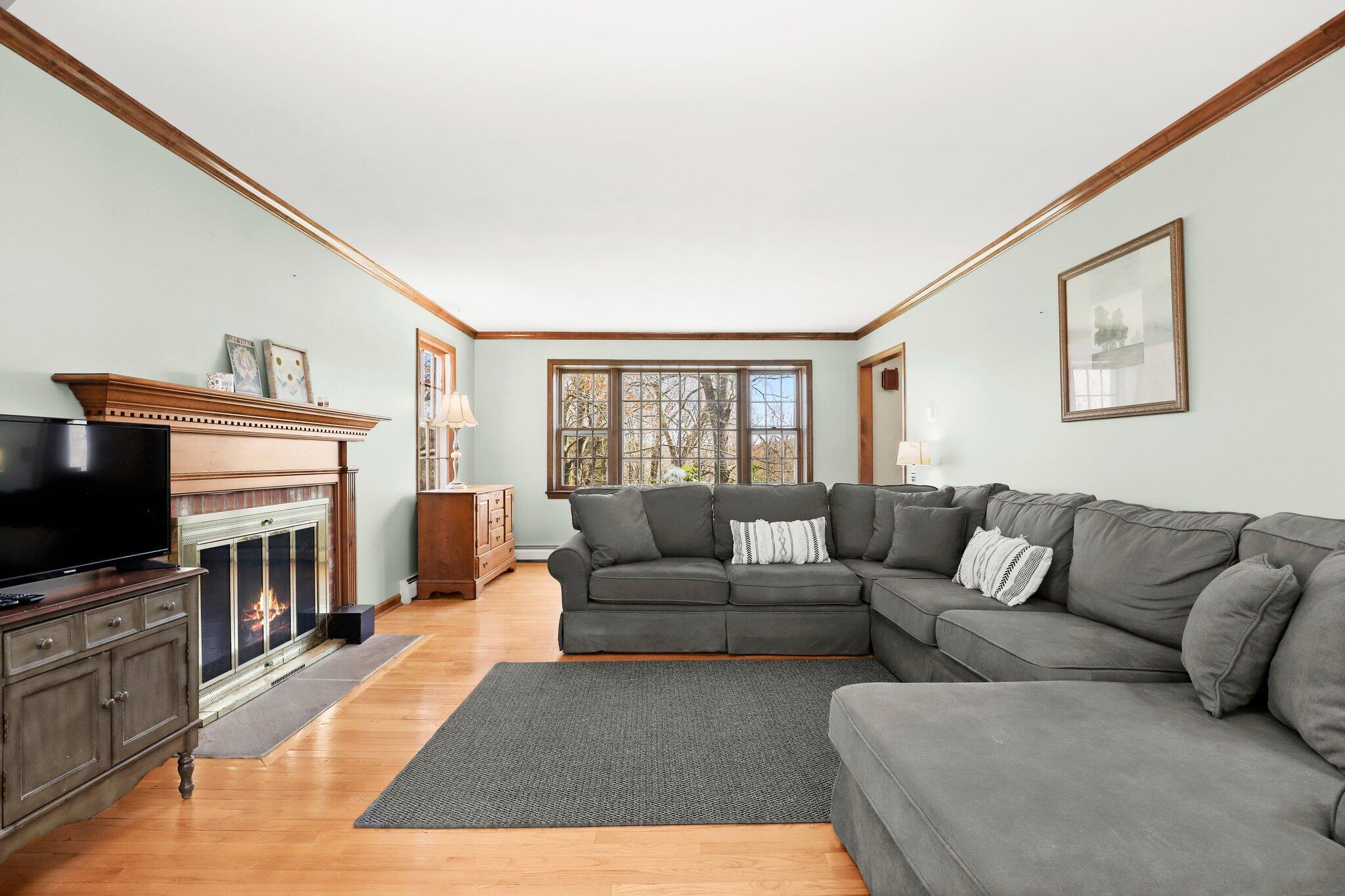 7 Allen Way Bethel, CT 06801 - Photo 4 of 31 a living room with furniture and a flat screen tv