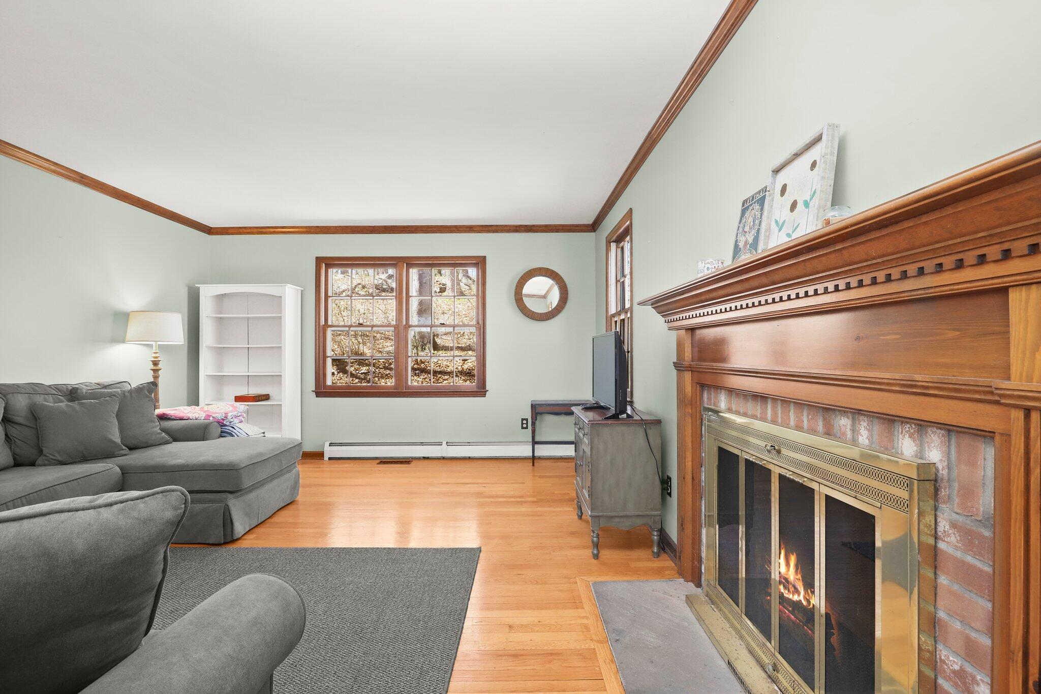 7 Allen Way Bethel, CT 06801 - Photo 5 of 31 a living room with furniture and a fireplace