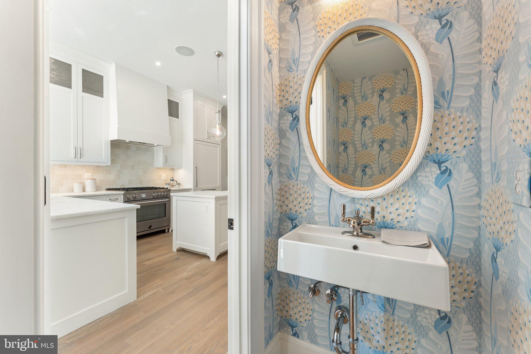 243 10th Street Northeast Washington, DC 20002 - Photo 24 of 73 a bathroom with a sink and a mirror