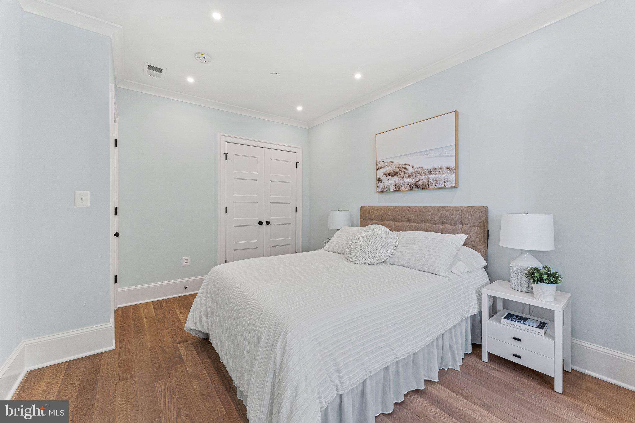 243 10th Street Northeast Washington, DC 20002 - Photo 37 of 73 a spacious bedroom with a bed and a window
