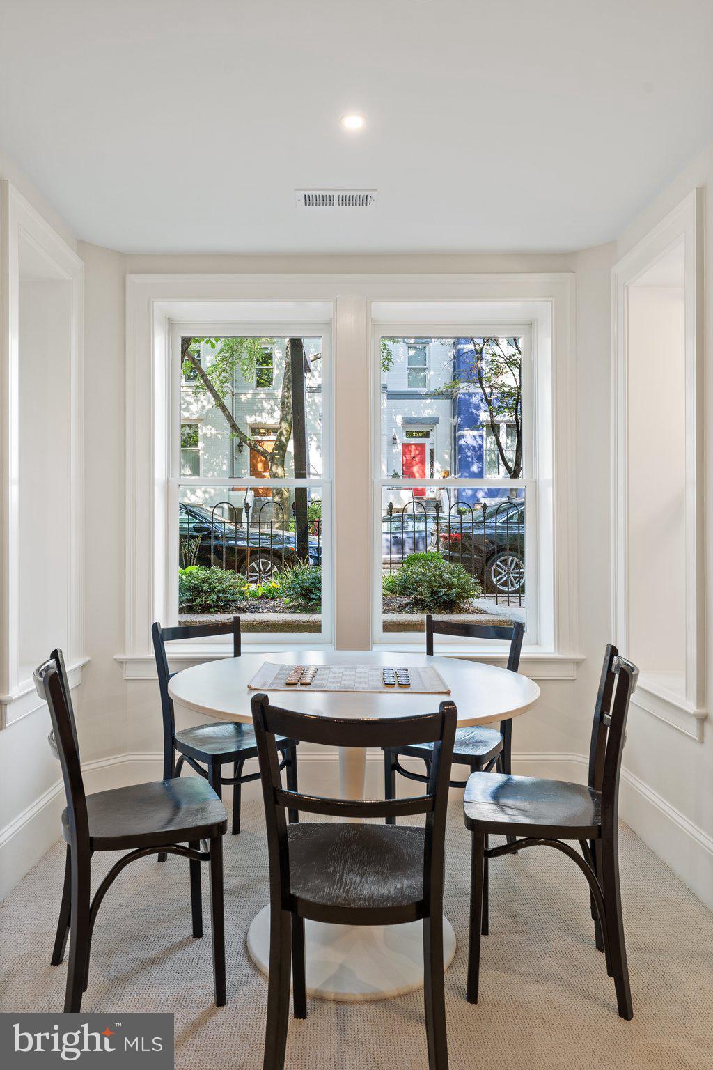 243 10th Street Northeast Washington, DC 20002 - Photo 43 of 73 a view of a dining room with furniture large window and outside view
