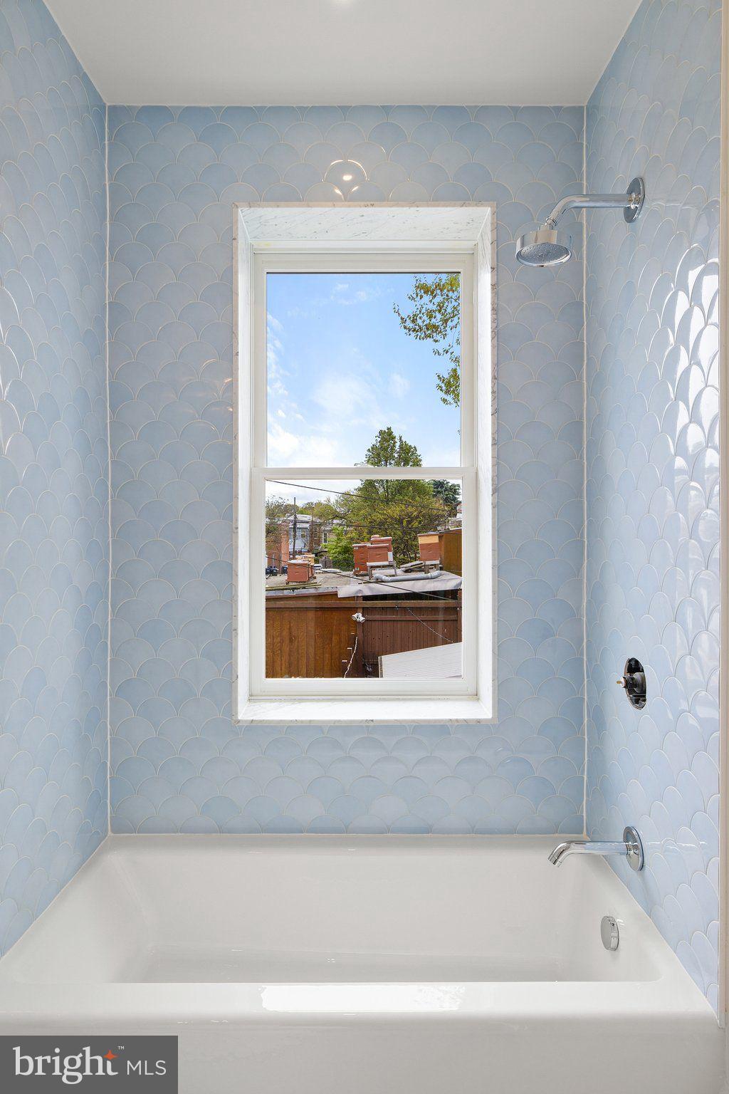 243 10th Street Northeast Washington, DC 20002 - Photo 61 of 73 a bathroom with a bathtub and shower
