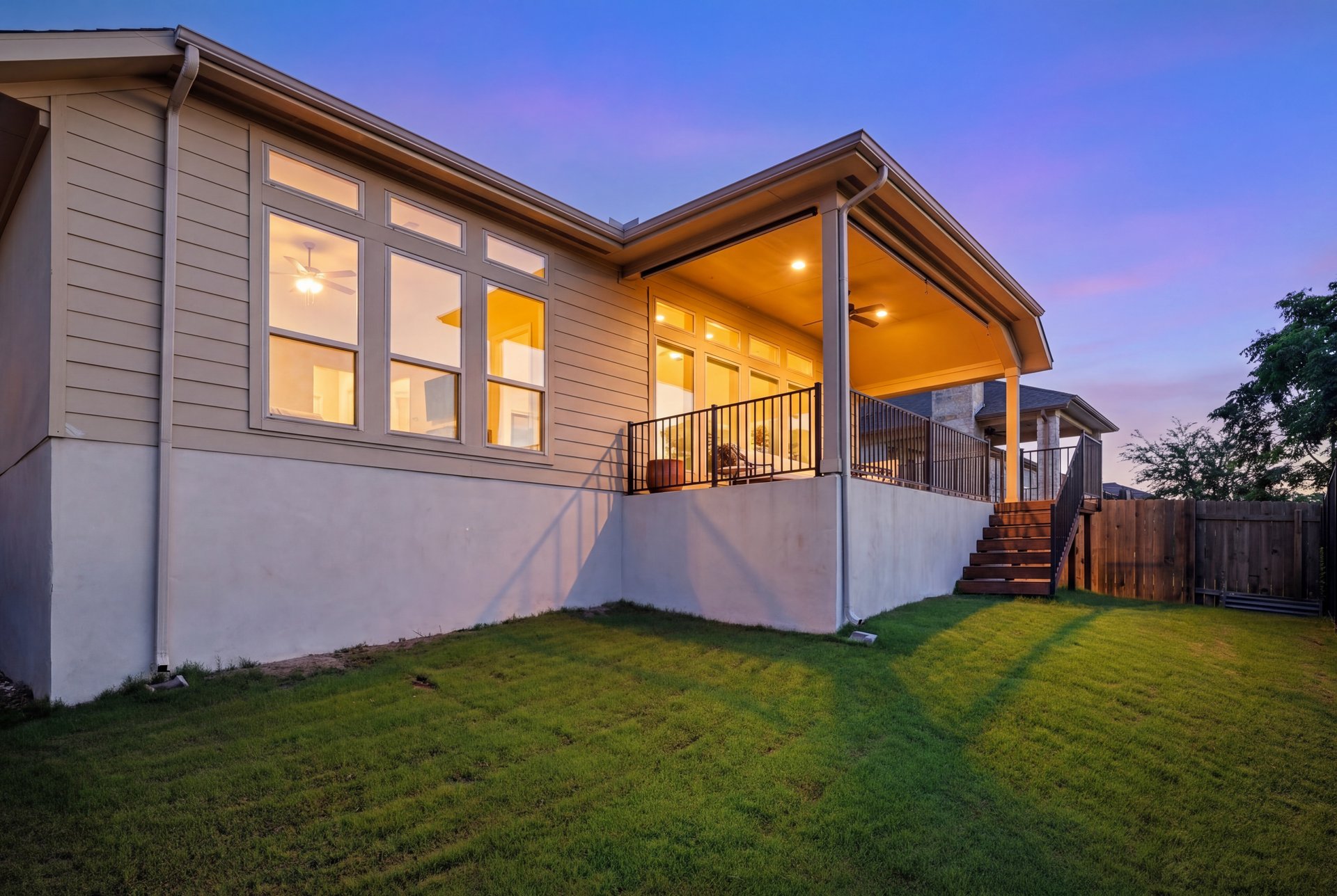 173 Santa Maria Street Georgetown, TX 78628 - Photo 32 of 39 Expansive backyard featuring a covered patio, staircase, and wood fence