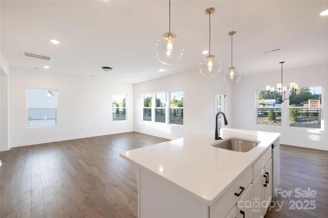 a kitchen with sink and window