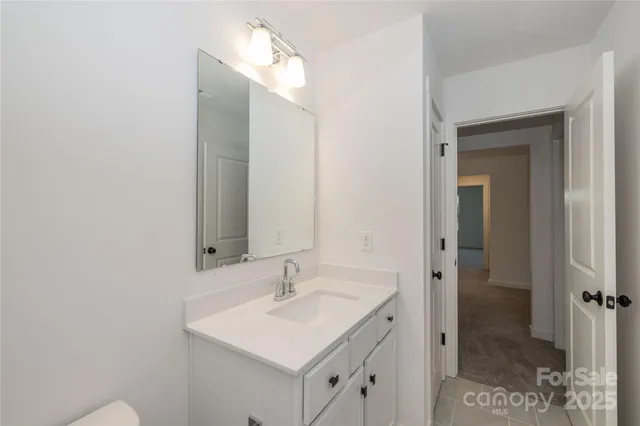 a bathroom with a sink a mirror and a shower