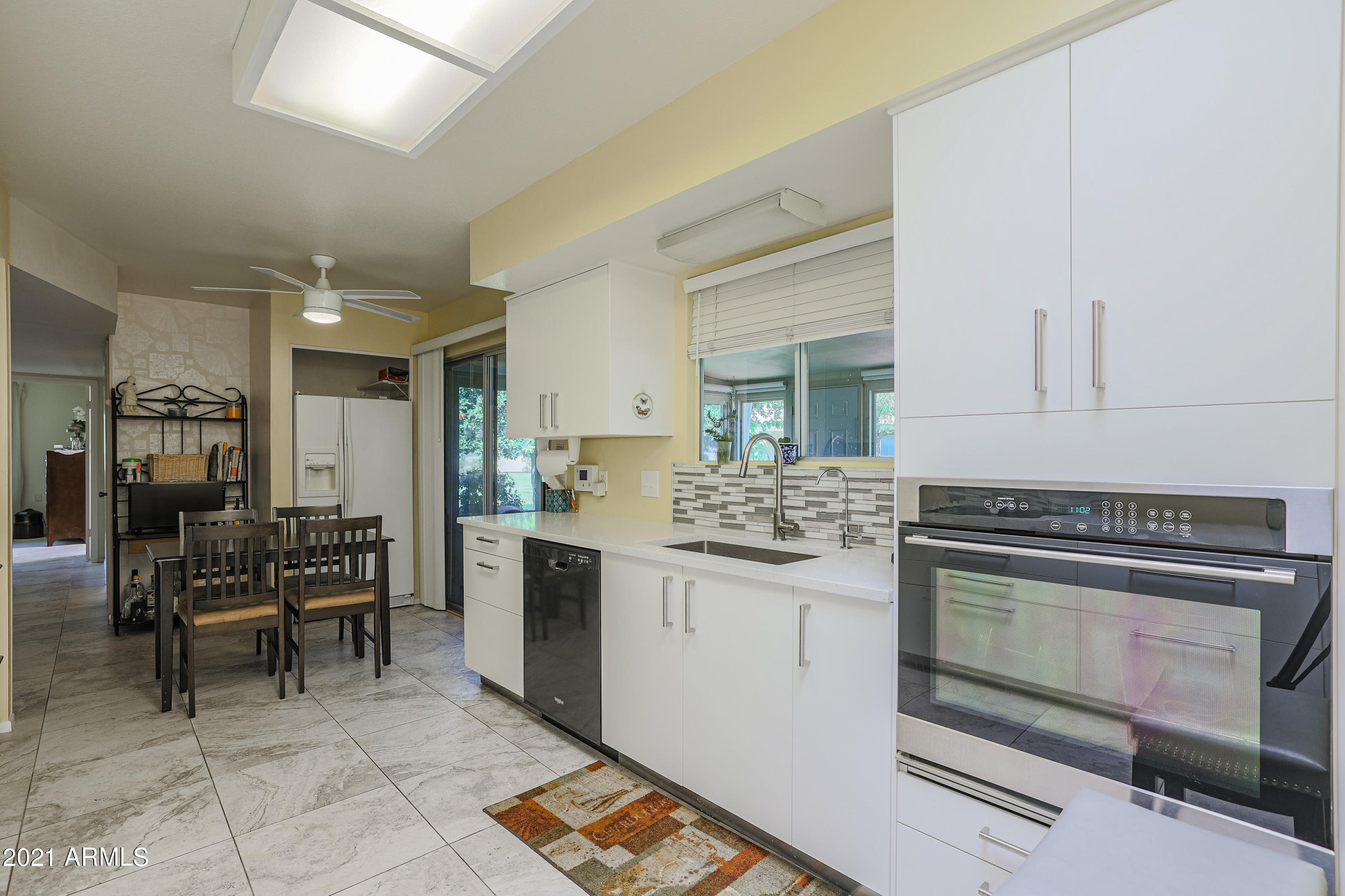 630 Leisure World Mesa, AZ 85206 - Photo 14 of 59 a kitchen with a stove and a refrigerator
