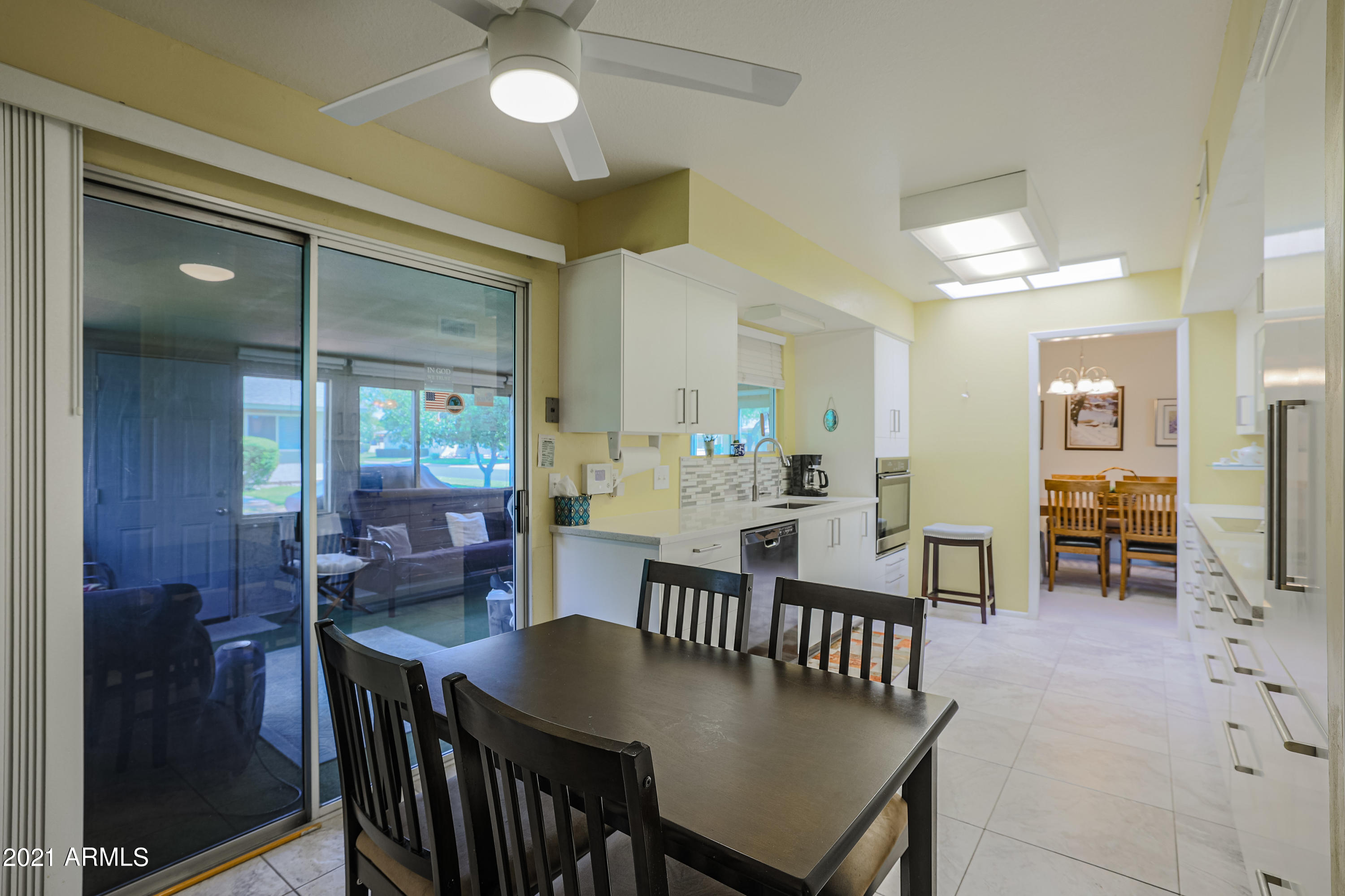630 Leisure World Mesa, AZ 85206 - Photo 15 of 59 a view of a a dining room with furniture window and wooden floor