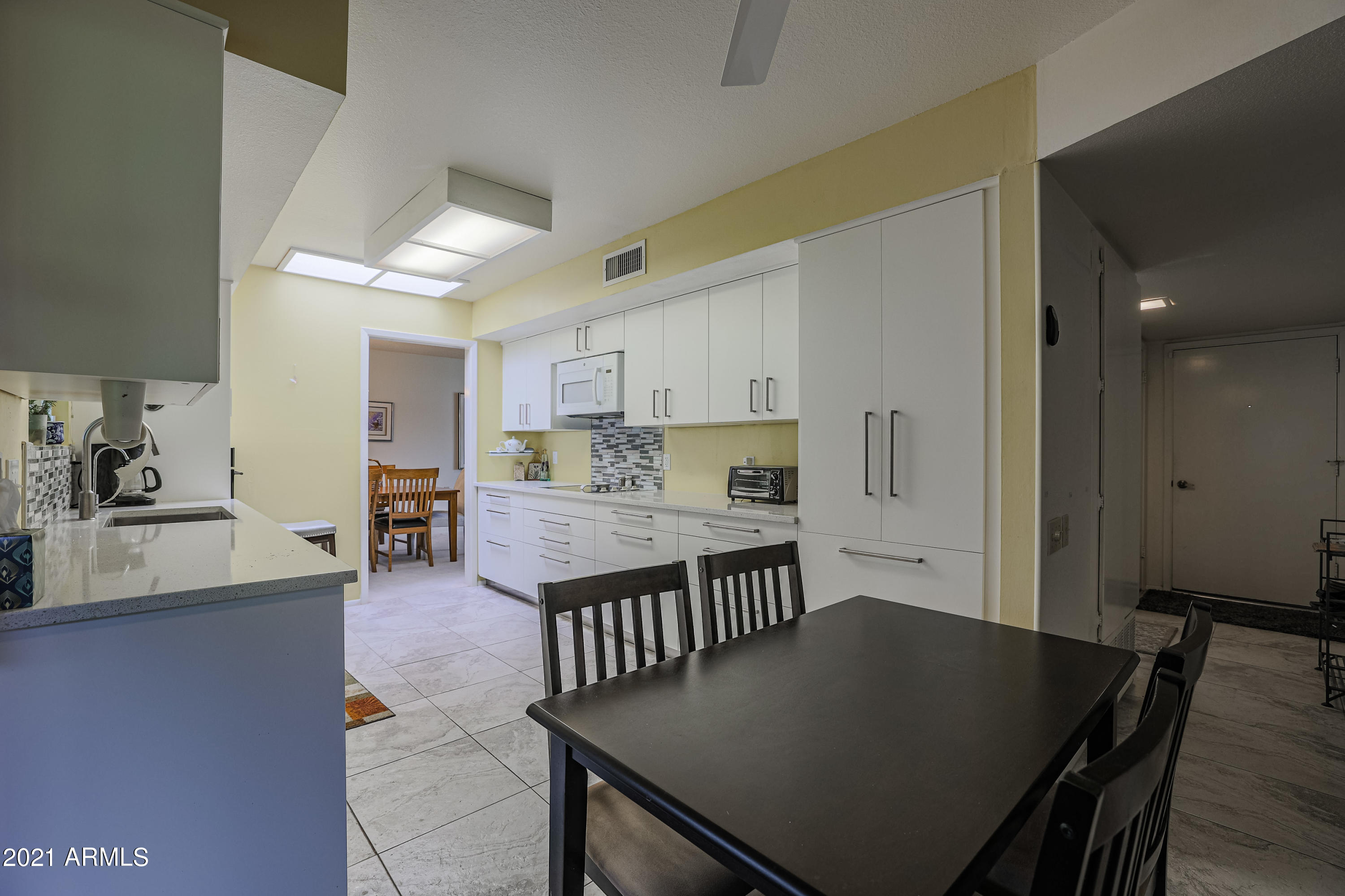 630 Leisure World Mesa, AZ 85206 - Photo 16 of 59 a view of a dining room with furniture