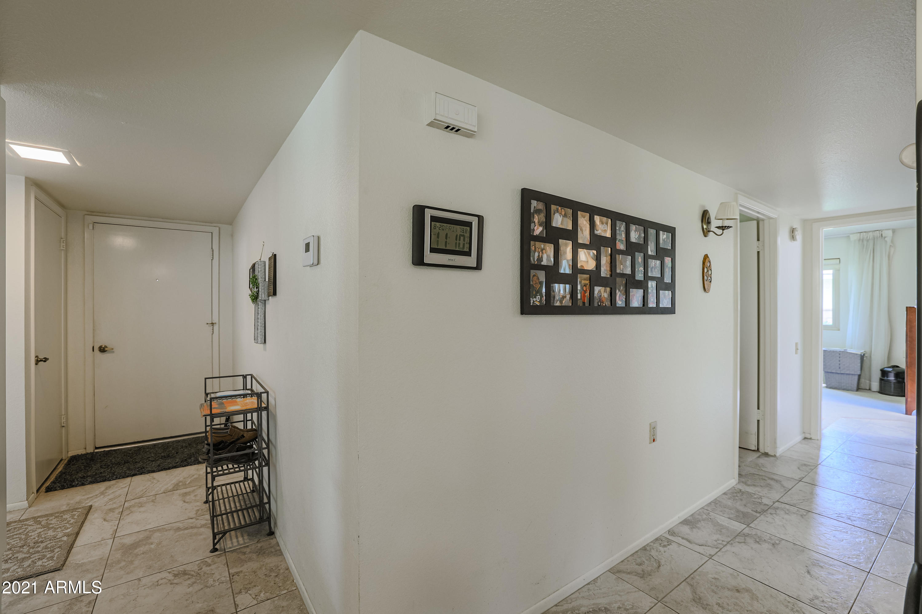 630 Leisure World Mesa, AZ 85206 - Photo 19 of 59 a view of a hallway with closet and a bathroom