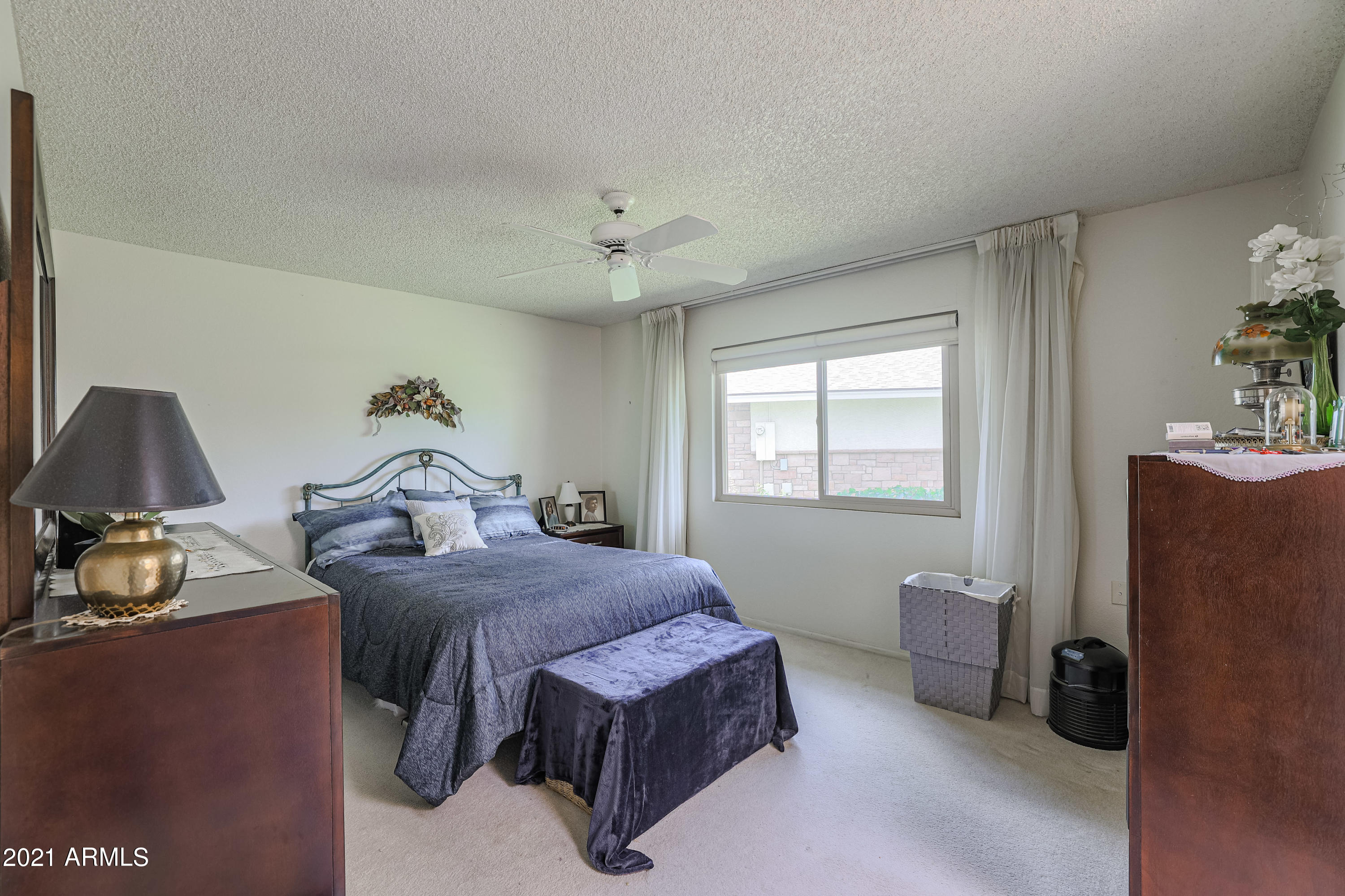 630 Leisure World Mesa, AZ 85206 - Photo 23 of 59 a bedroom with a bed and a window