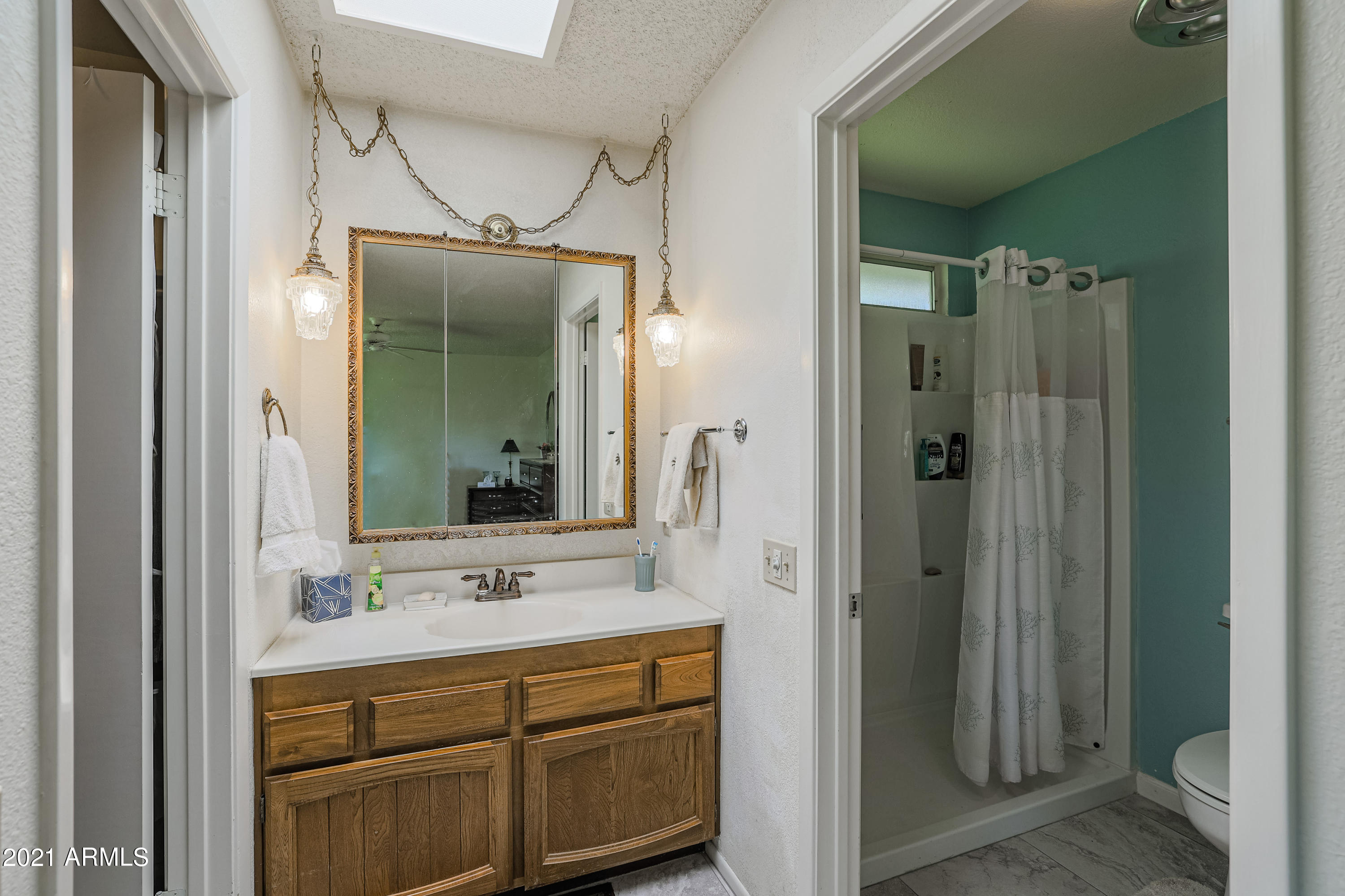 630 Leisure World Mesa, AZ 85206 - Photo 26 of 59 a bathroom with a sink and a mirror