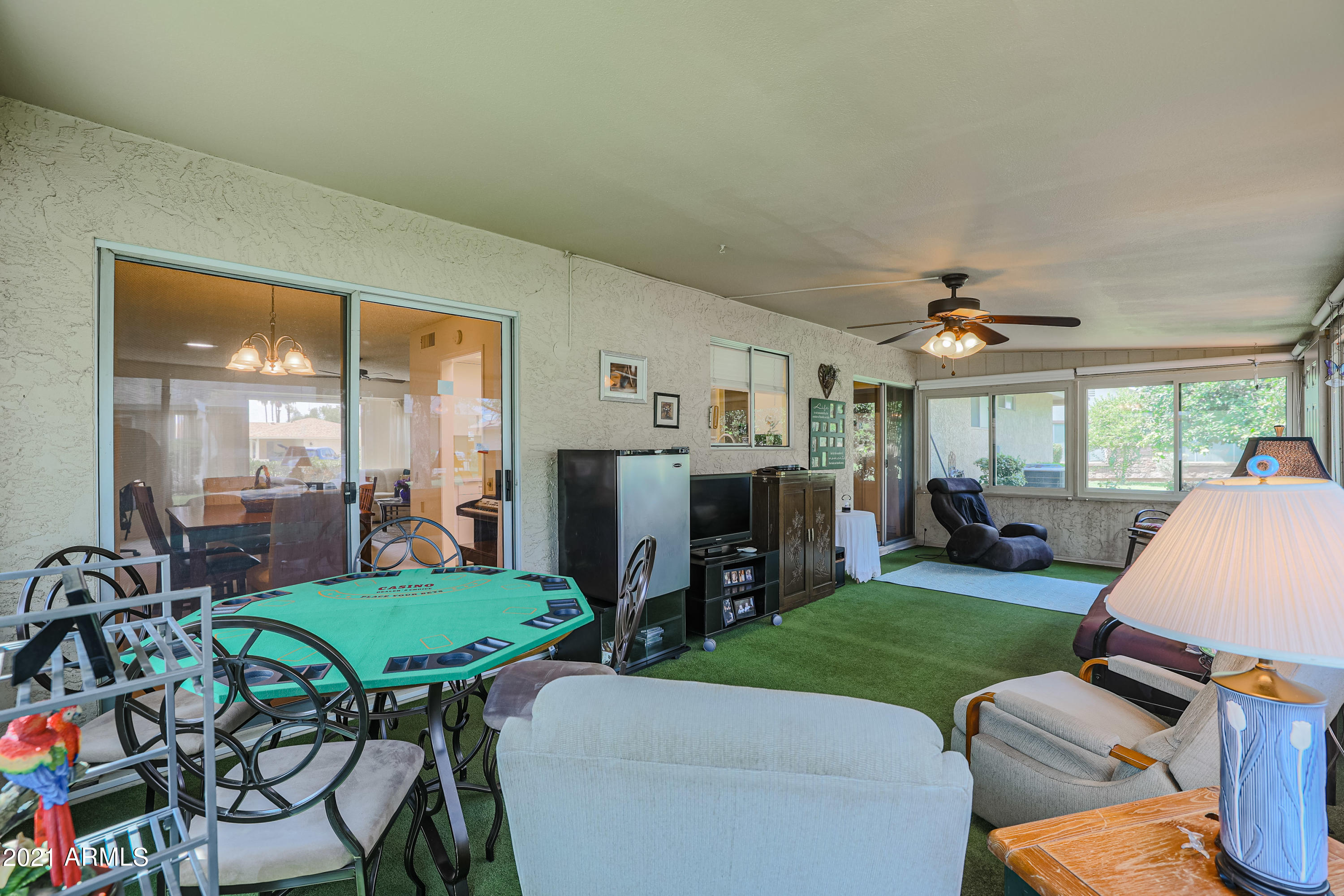 630 Leisure World Mesa, AZ 85206 - Photo 29 of 59 a living room with furniture a flat screen tv and a fireplace