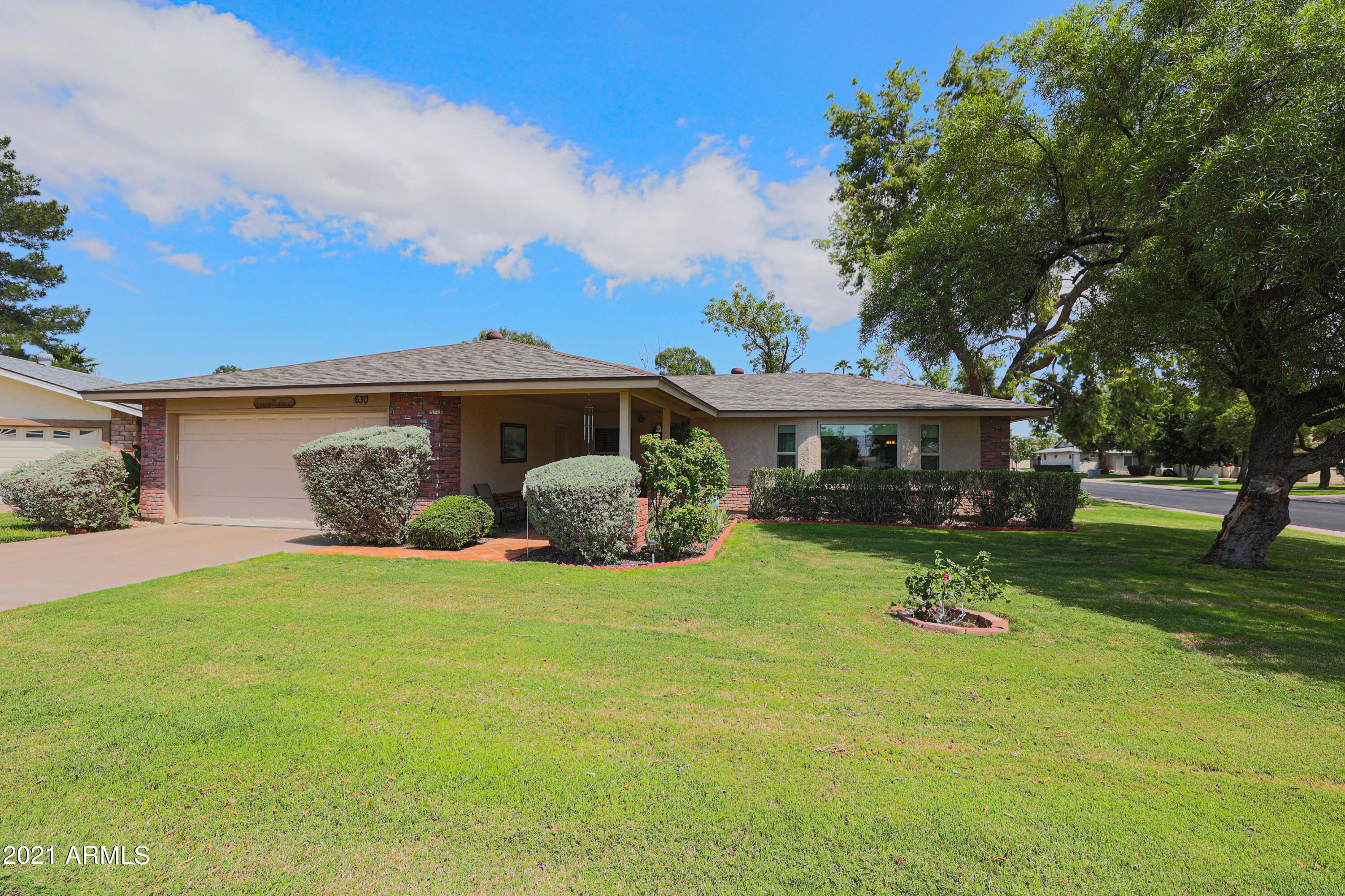 630 Leisure World Mesa, AZ 85206 - Photo 3 of 59 a front view of a house with a yard